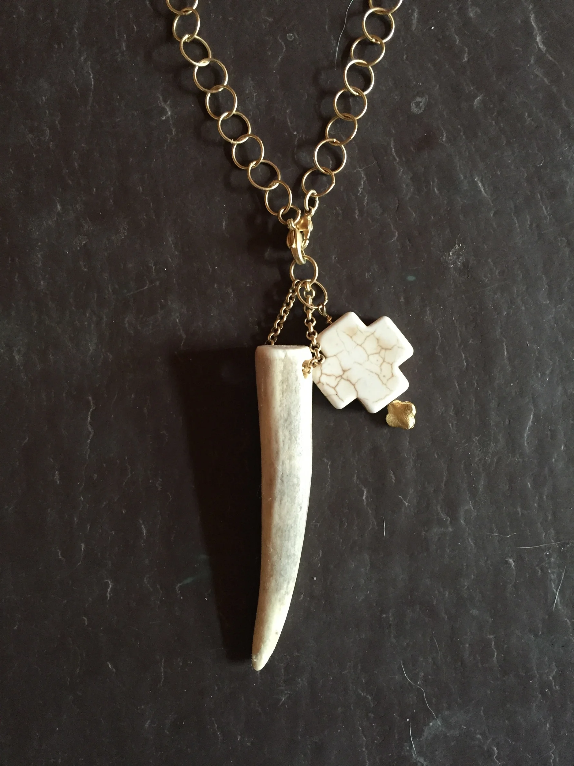 antler and cross