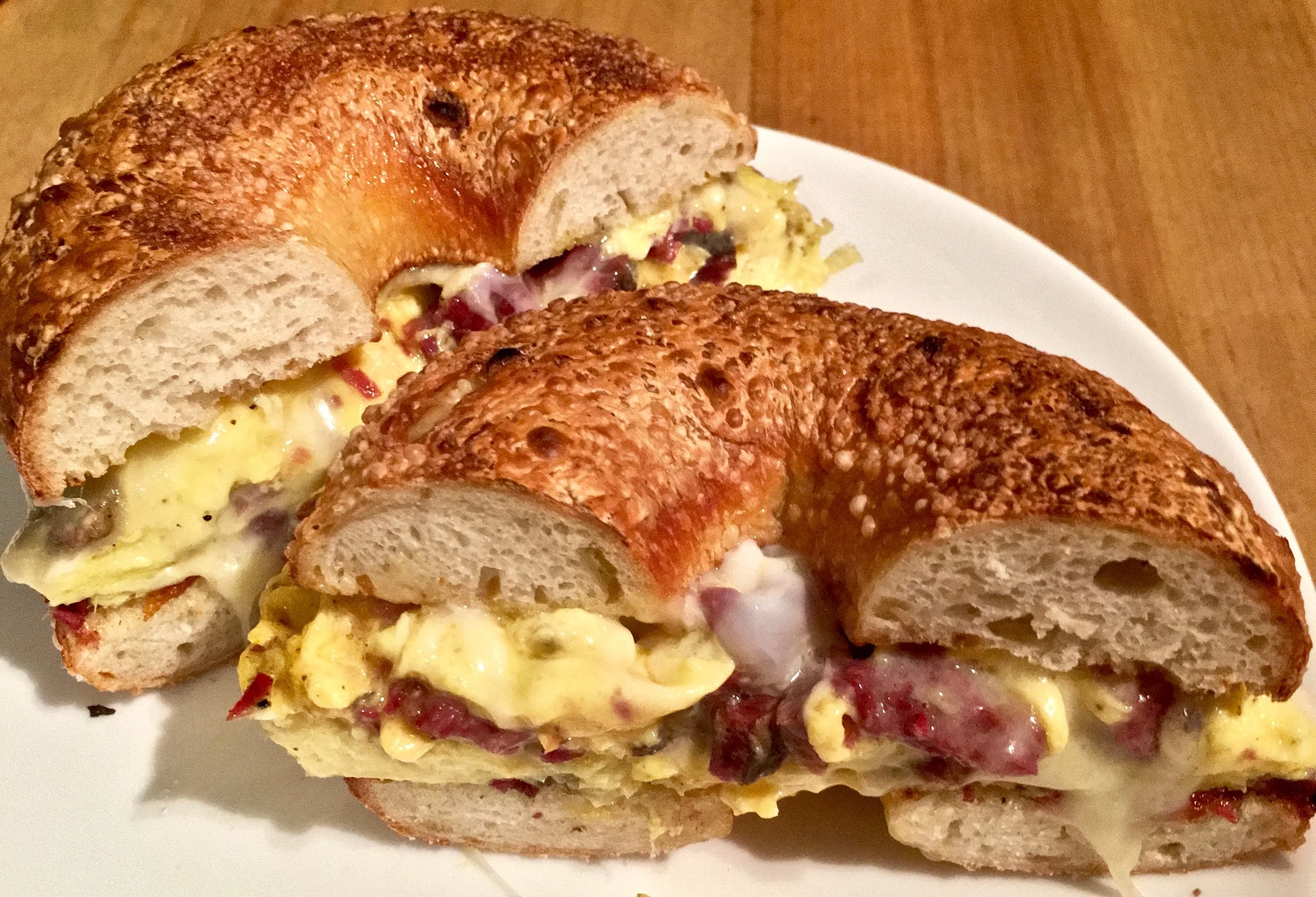  egg, white cheddar and pastrami on an onion bagel
