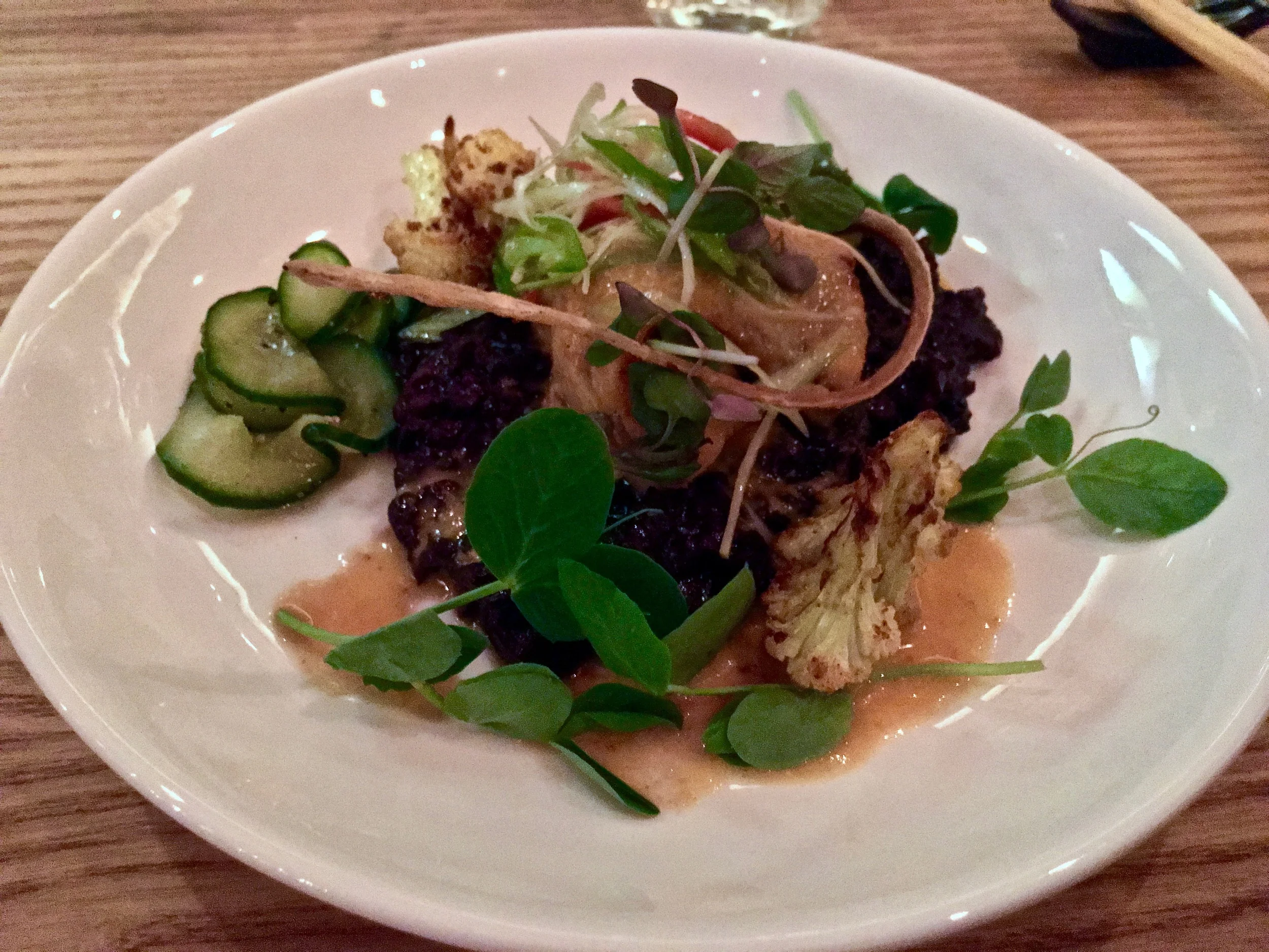 Coconut Curry Stingray : deep fried, curried stingray with black rice, ginger, chiles, roasted cauliflower, pea shoots and pickled cucumbers. 