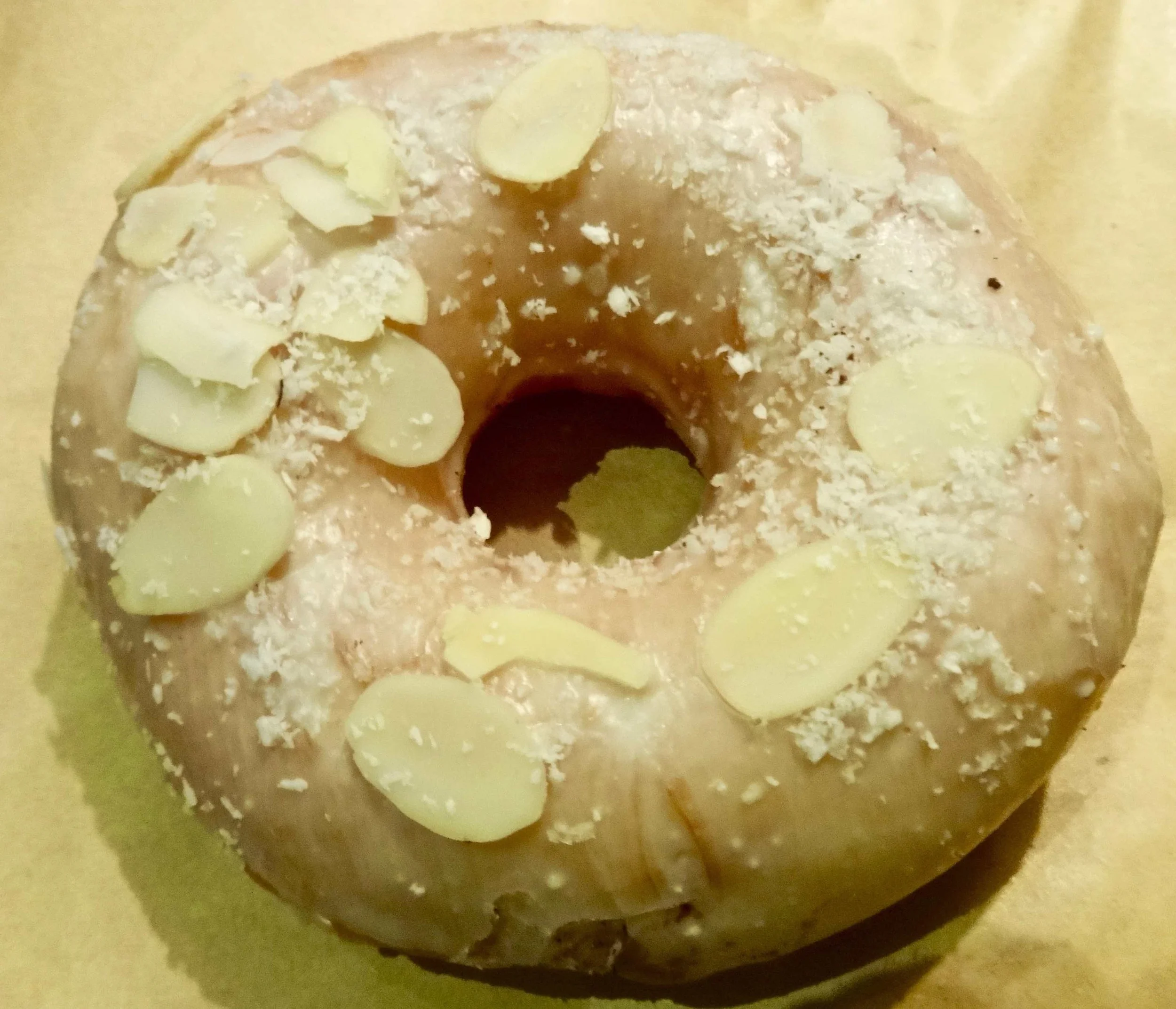 sugar glaze with shaved white chocolate and almond slivers