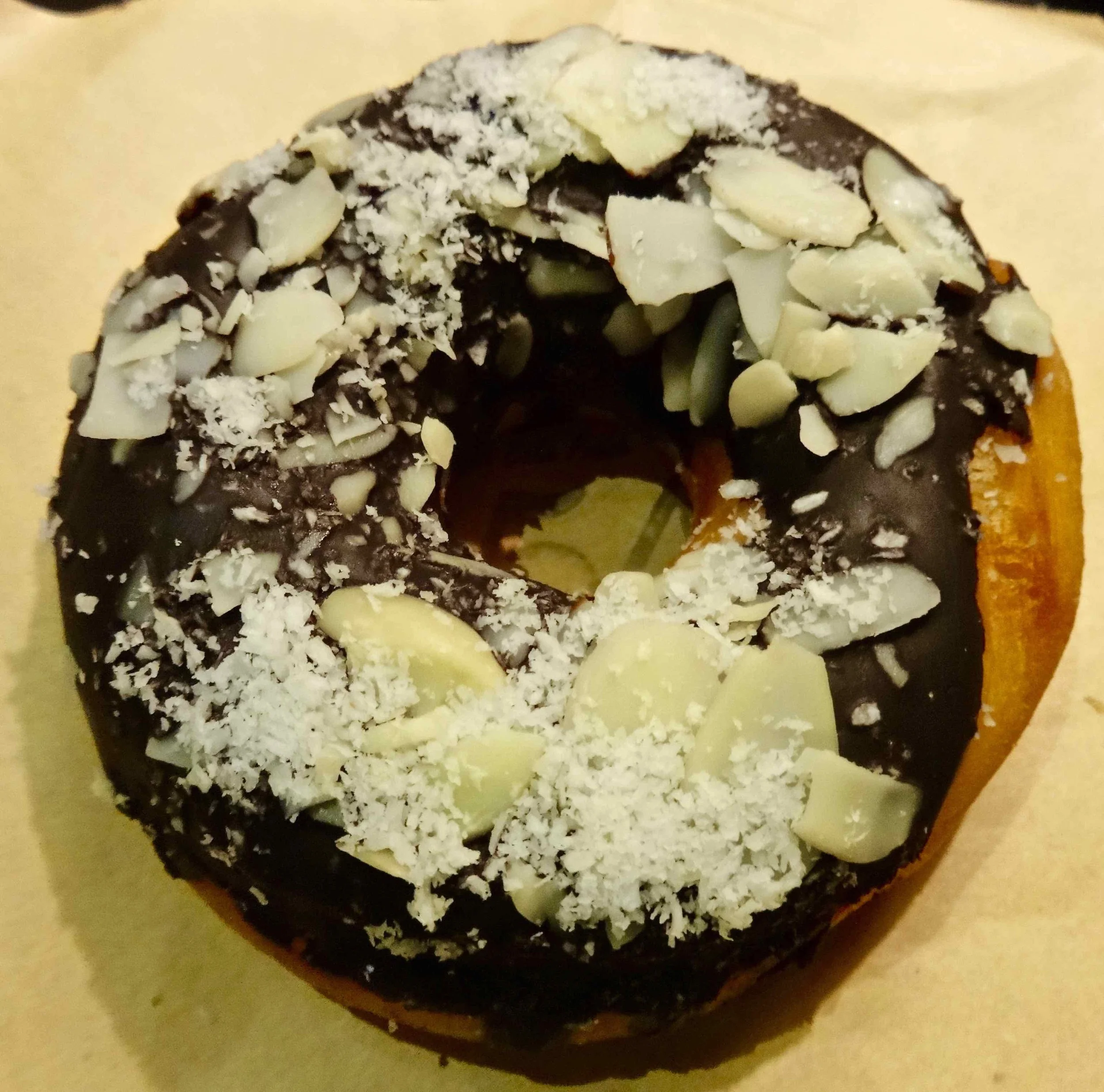 dark chocolate glaze with shaved white chocolate and almond slivers