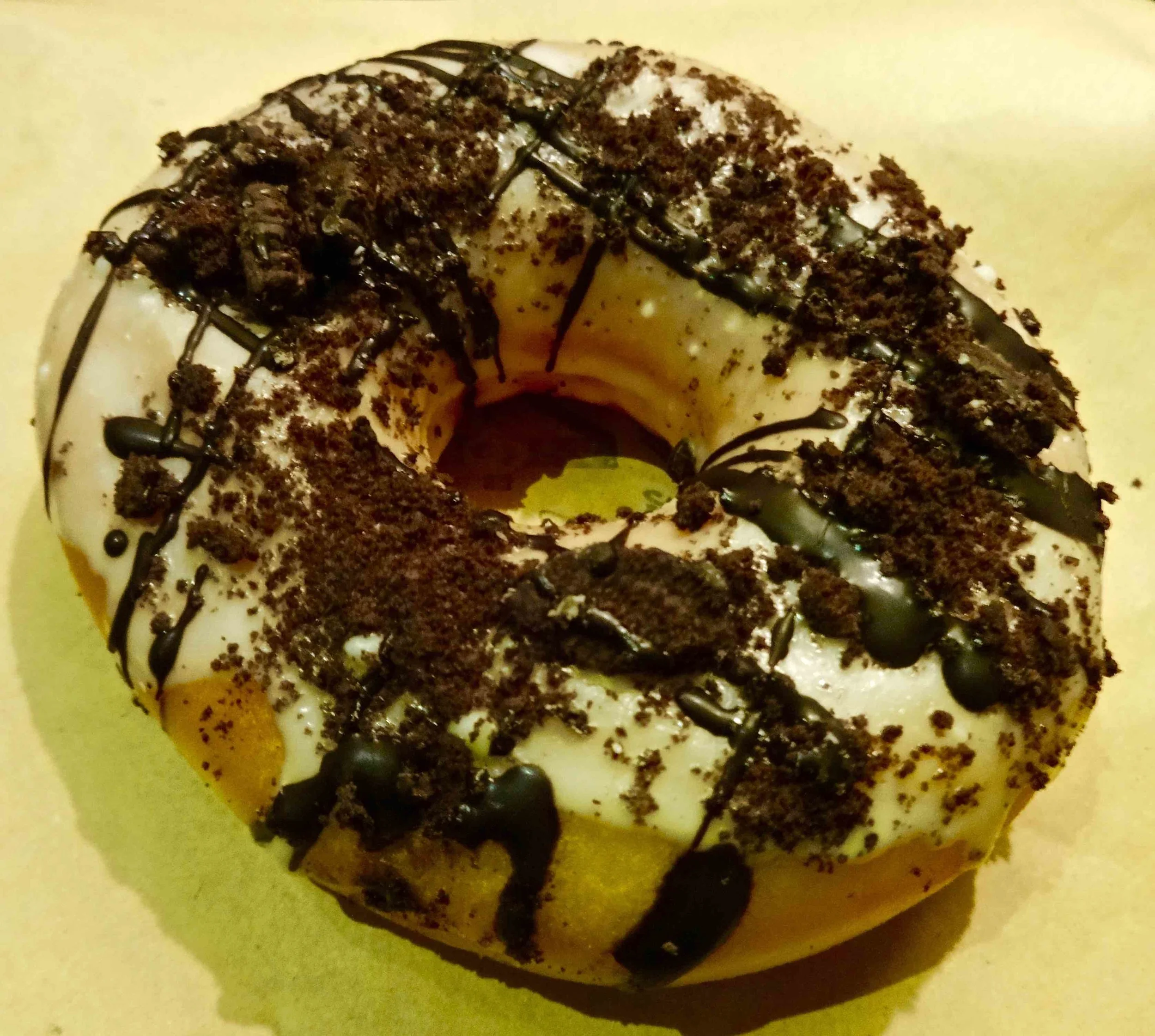 sugar glaze with dark chocolate drizzle and Oreo cookie crumbs