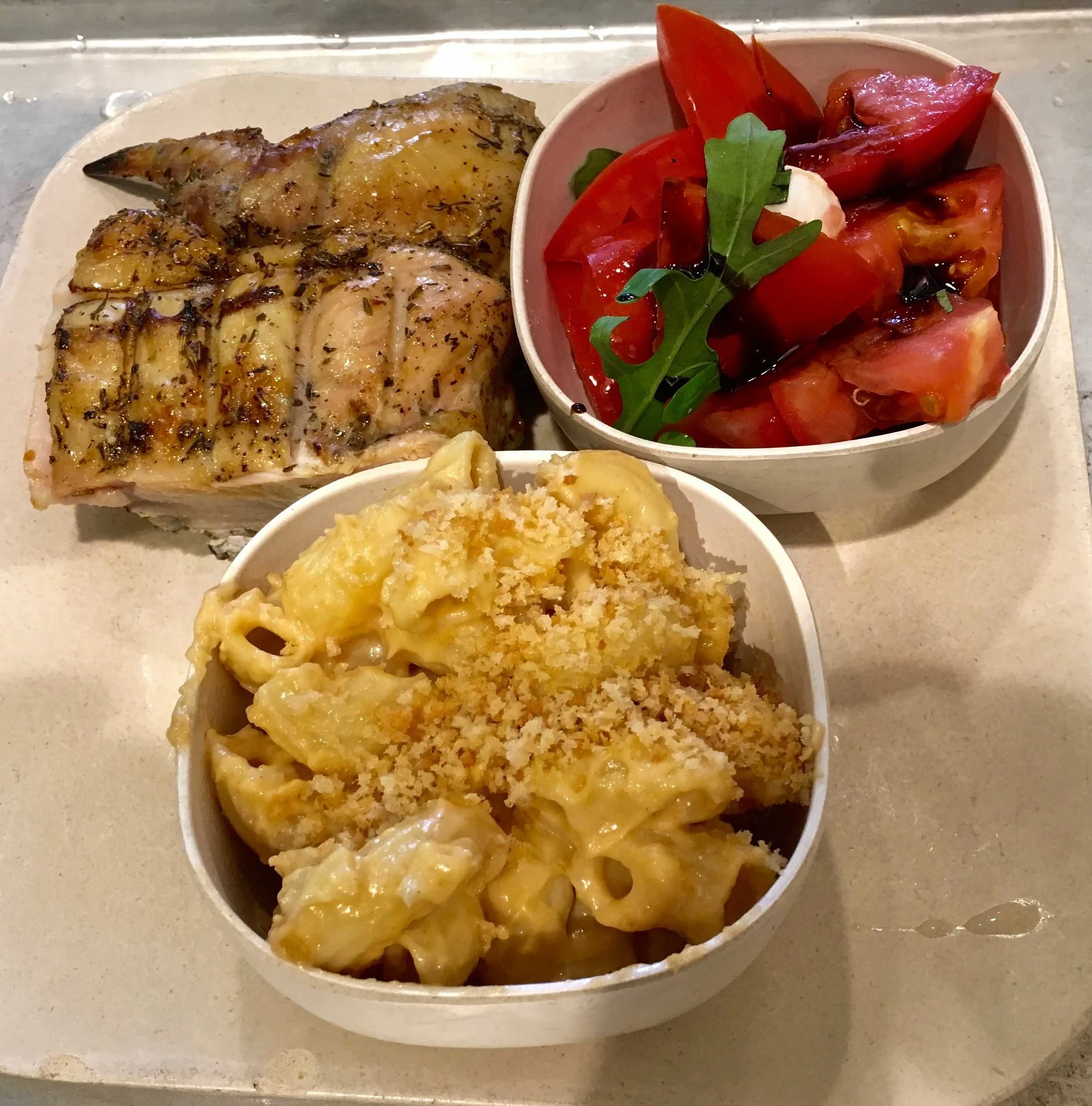 quarter Mediterranean chicken with mac and cheese and caprese salad