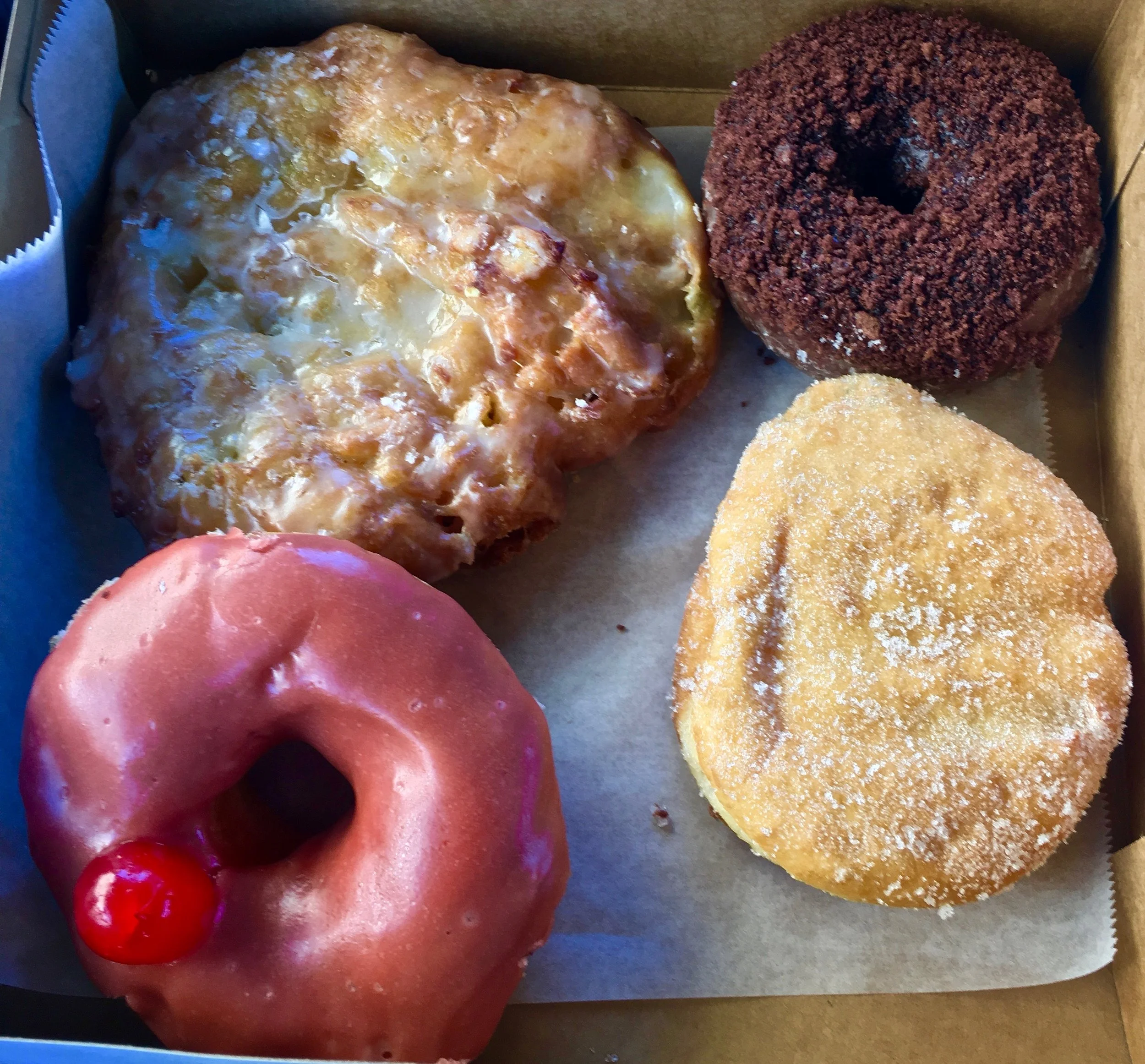 apple fritter chocolate chocolate cake raspberry jelly and cheerwine donuts