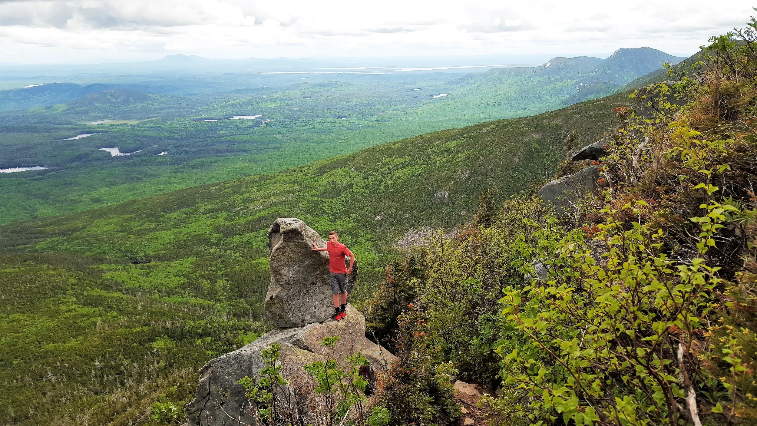 On the balanced rock. That’s Doubletop and Moose Mountains in the distance