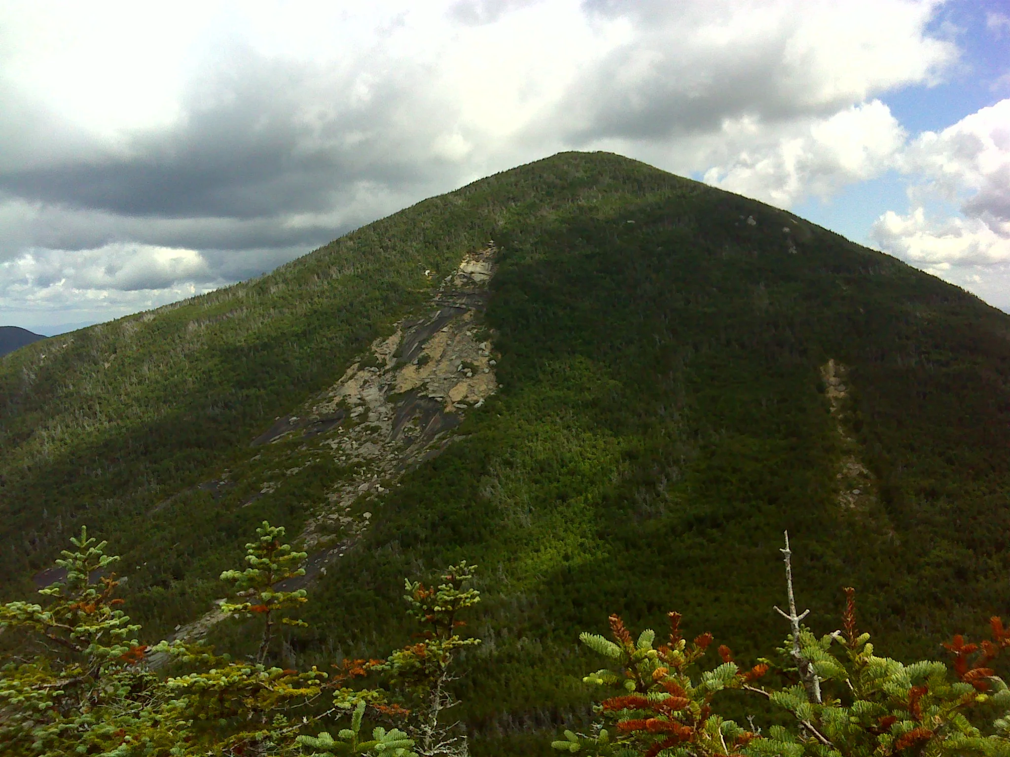 Mount Coe from Mount O-J-I. The trail goes up the slide, which earns the mountain its WW25 spot