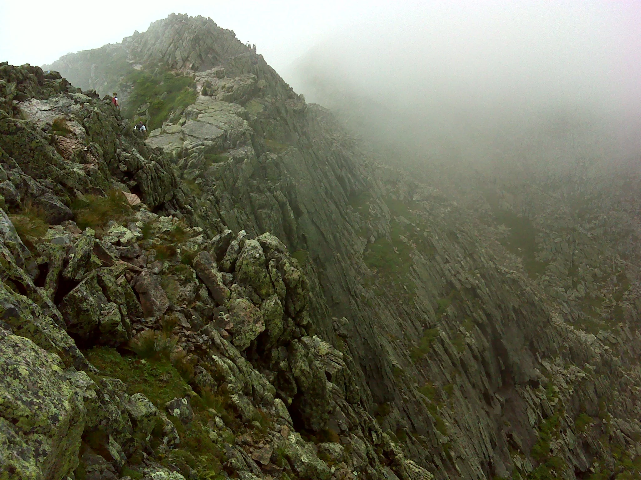 Rollercoastering along the Knife Edge as clouds caress the rock