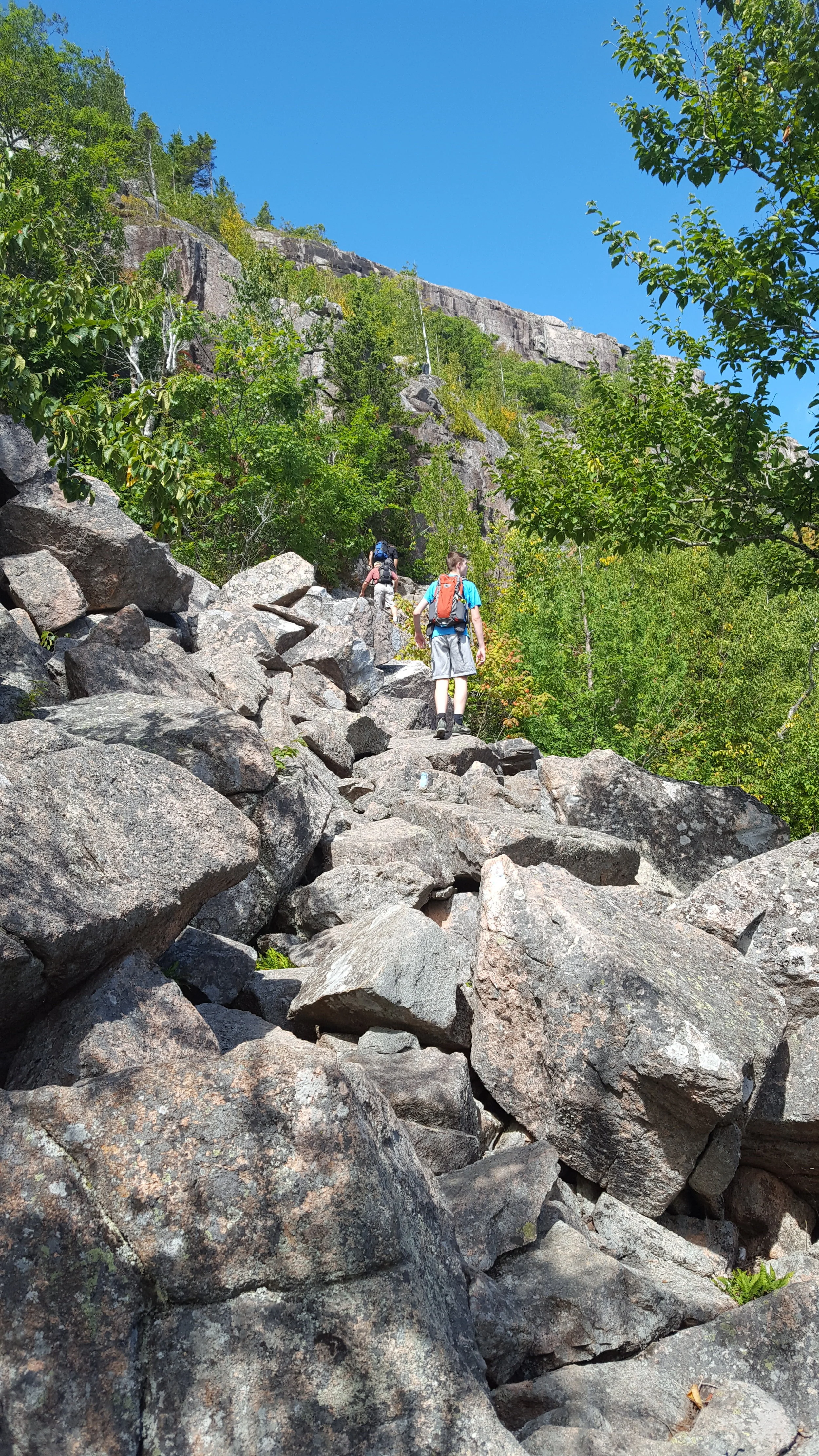 Climbing to the base of the cliffs