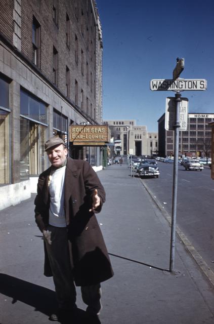 HHM Gateway183-Older man - looks like a resident of the neighborhood along Washington S., South Seas Bar & Lounge in back ground as is Post Office.jpg