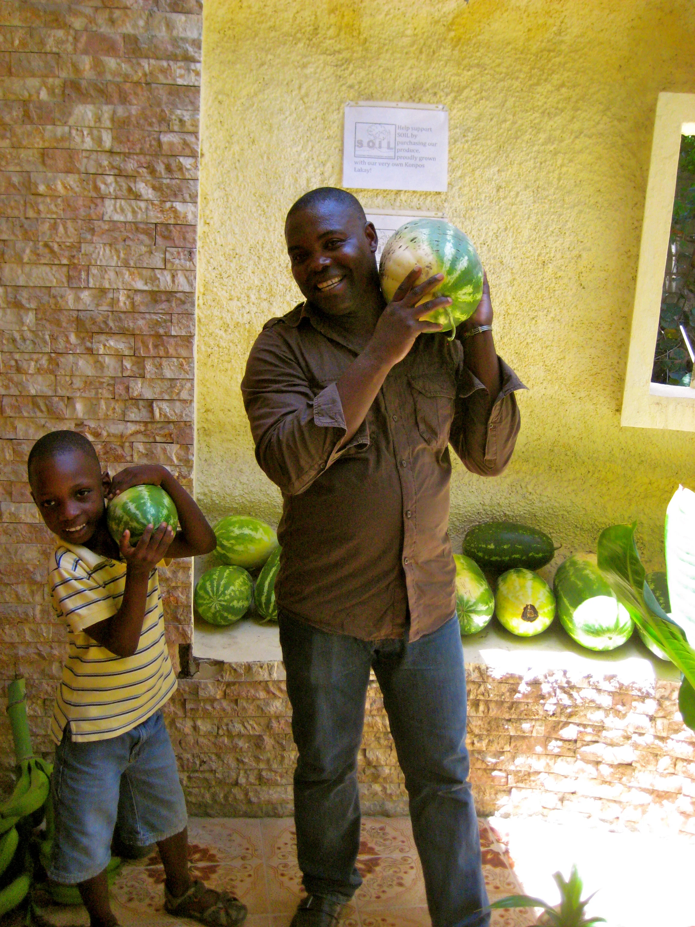 Baudeler with one of the sponsored children. Photo credit: SOIL.