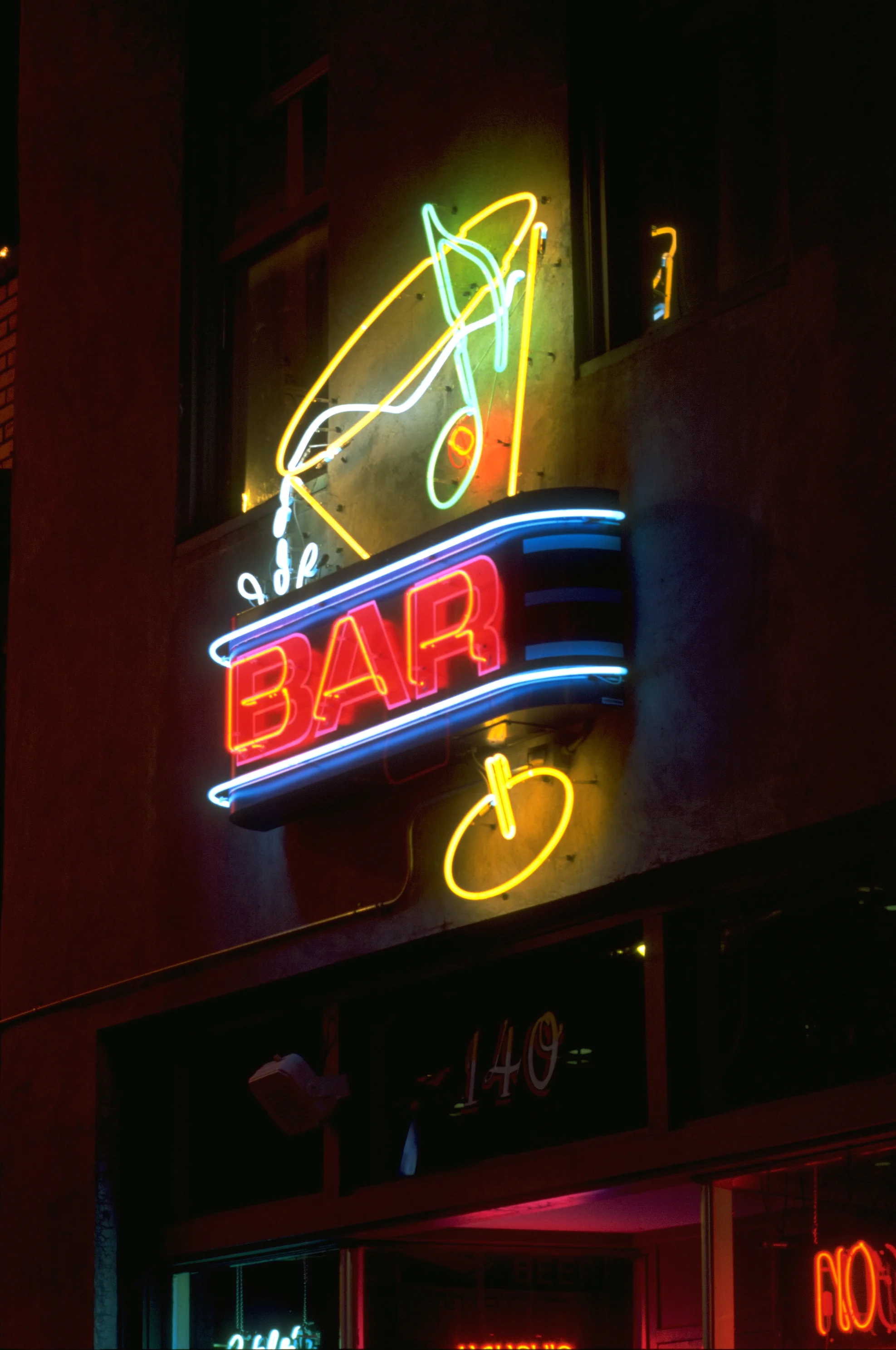  Blues City Cafe Bar exterior neon sign  Branding creative and design © Chuck Mitchell  “Dripping Martini” with olive note  Beale Street Memphis, Tennessee  Sign fabrication by Frank Balton Sign Co. 