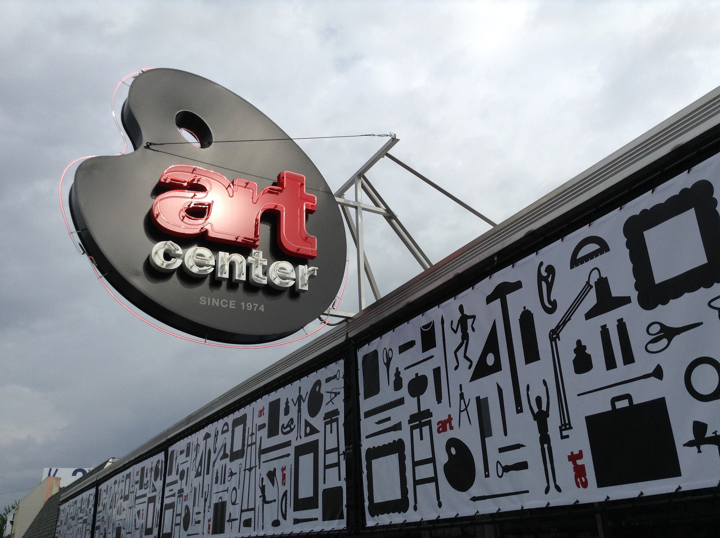  Art Center neon signage east face  with awning graphics  Creative and design by Chuck Mitchell 