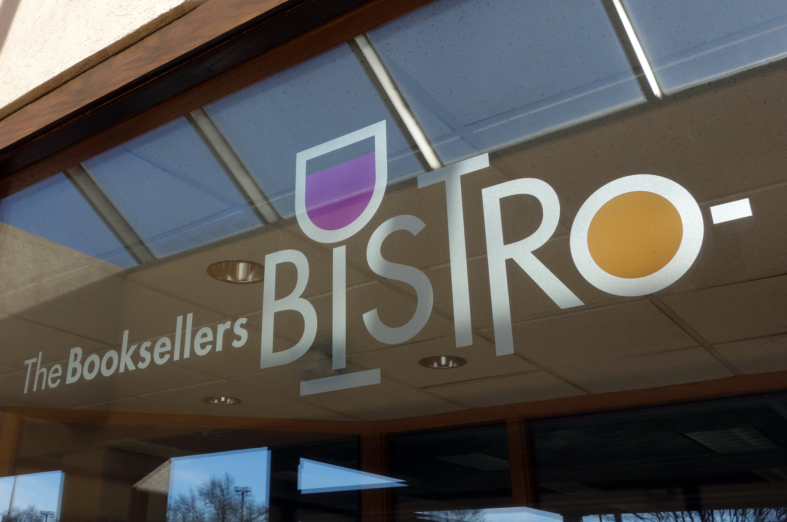  The Booksellers Bistro exterior signage  Creative and design by Chuck Mitchell  Laurelwood Center Memphis, Tennessee  Sign fabrication and installation by Frank Balton Sign Company 