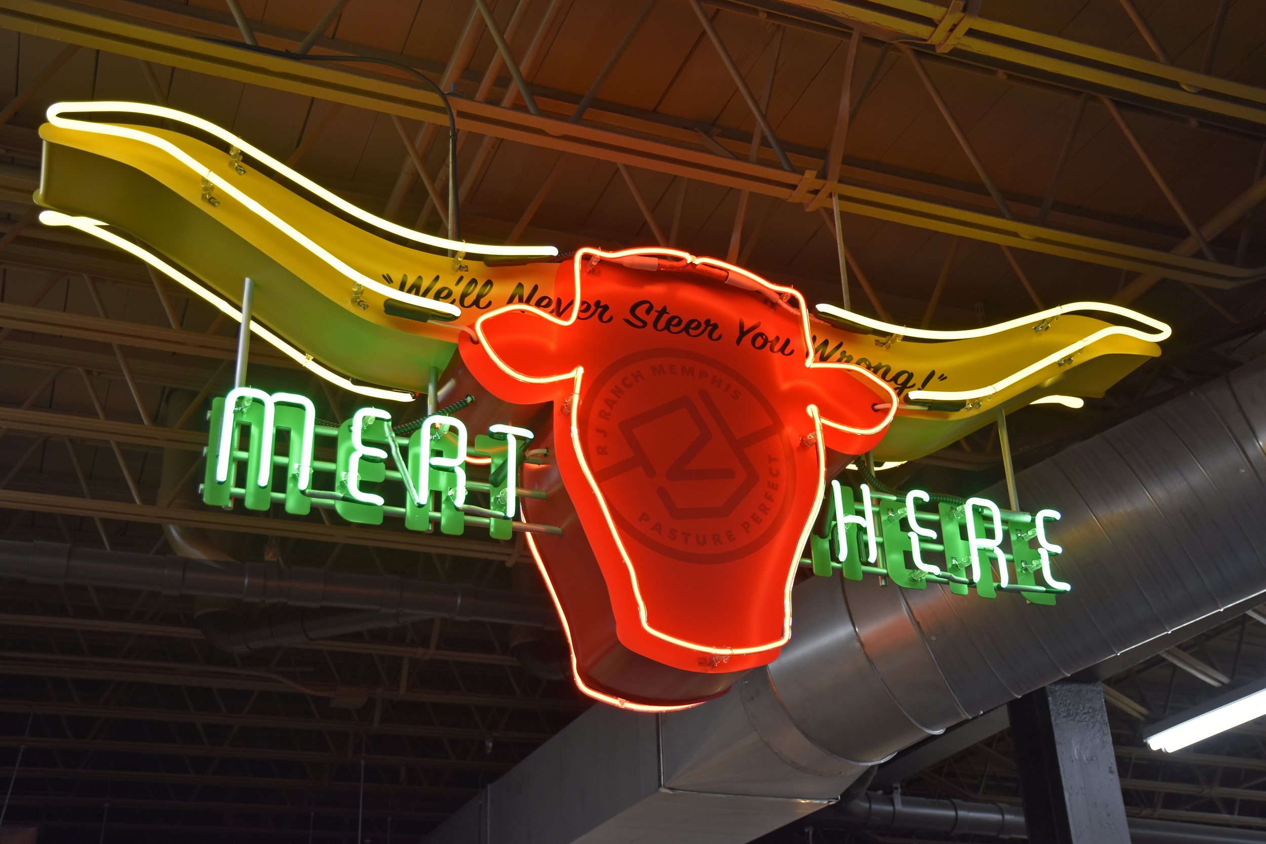  South Point Grocery  Downtown Memphis  “Meat Here Steer” meat department neon sign  Branding creative and design by Chuck Mitchell  Sign fabrication and installation by Frank Balton Sign Company 