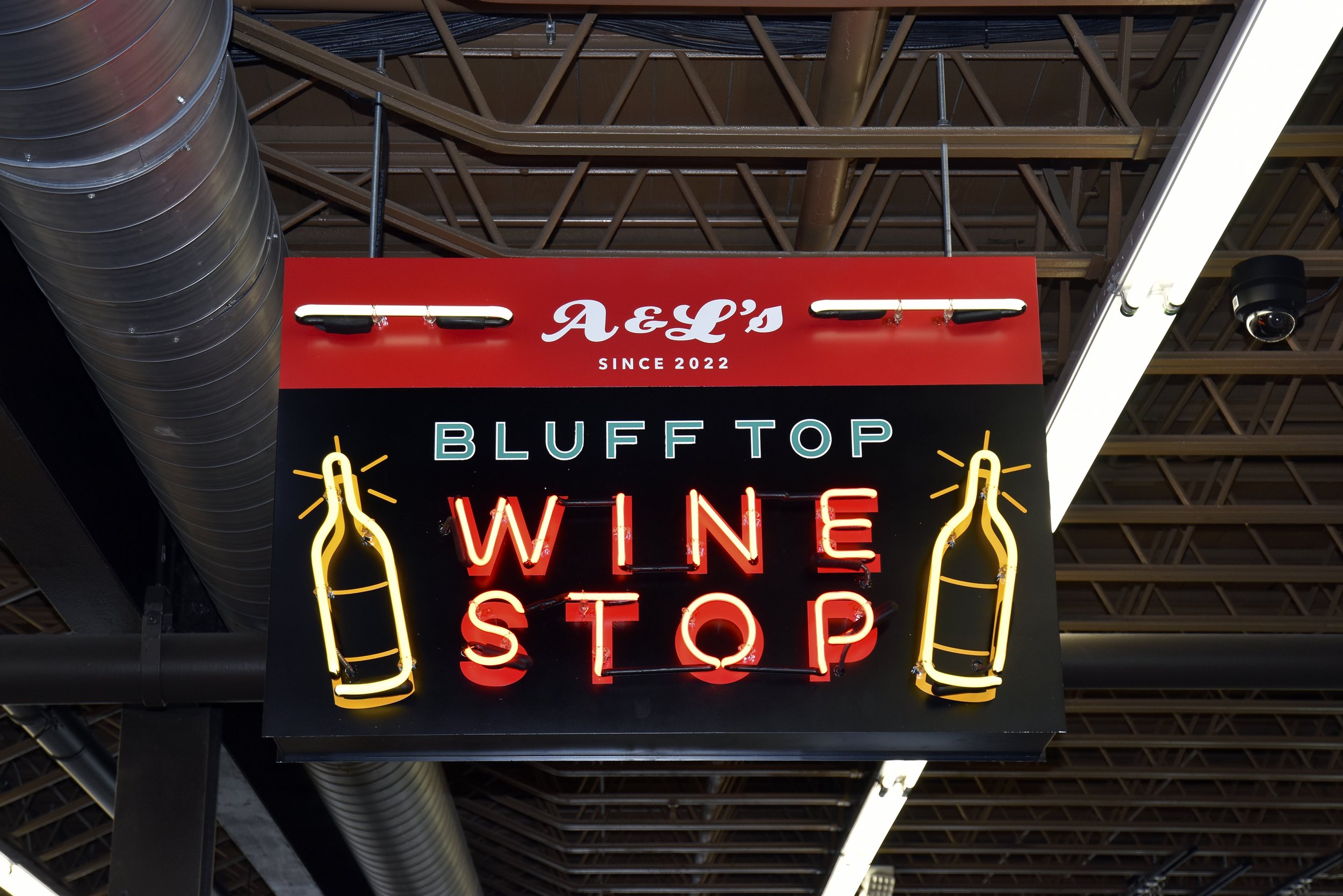  South Point Grocery  Downtown Memphis  “Bluff Top Wine Stop” department neon sign  Branding creative and design by Chuck Mitchell  Sign fabrication and installation by Frank Balton Sign Company 