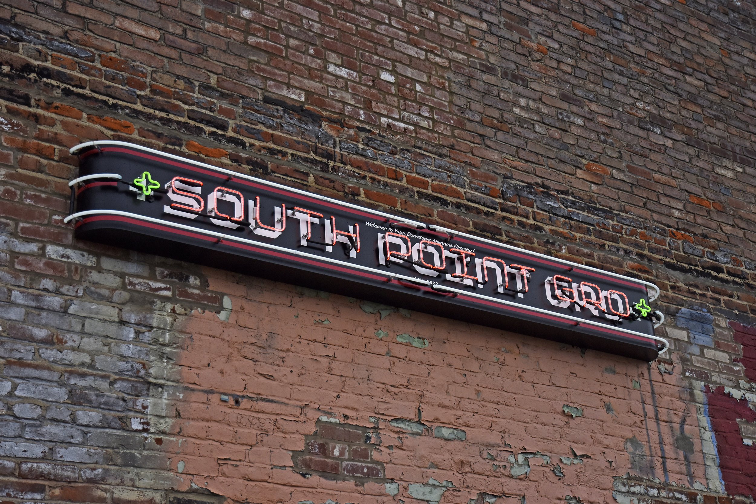  South Point Grocery  Downtown Memphis  “South Point Gro” east entrance neon sign  Branding creative and design by Chuck Mitchell  Sign fabrication and installation by Frank Balton Sign Company 