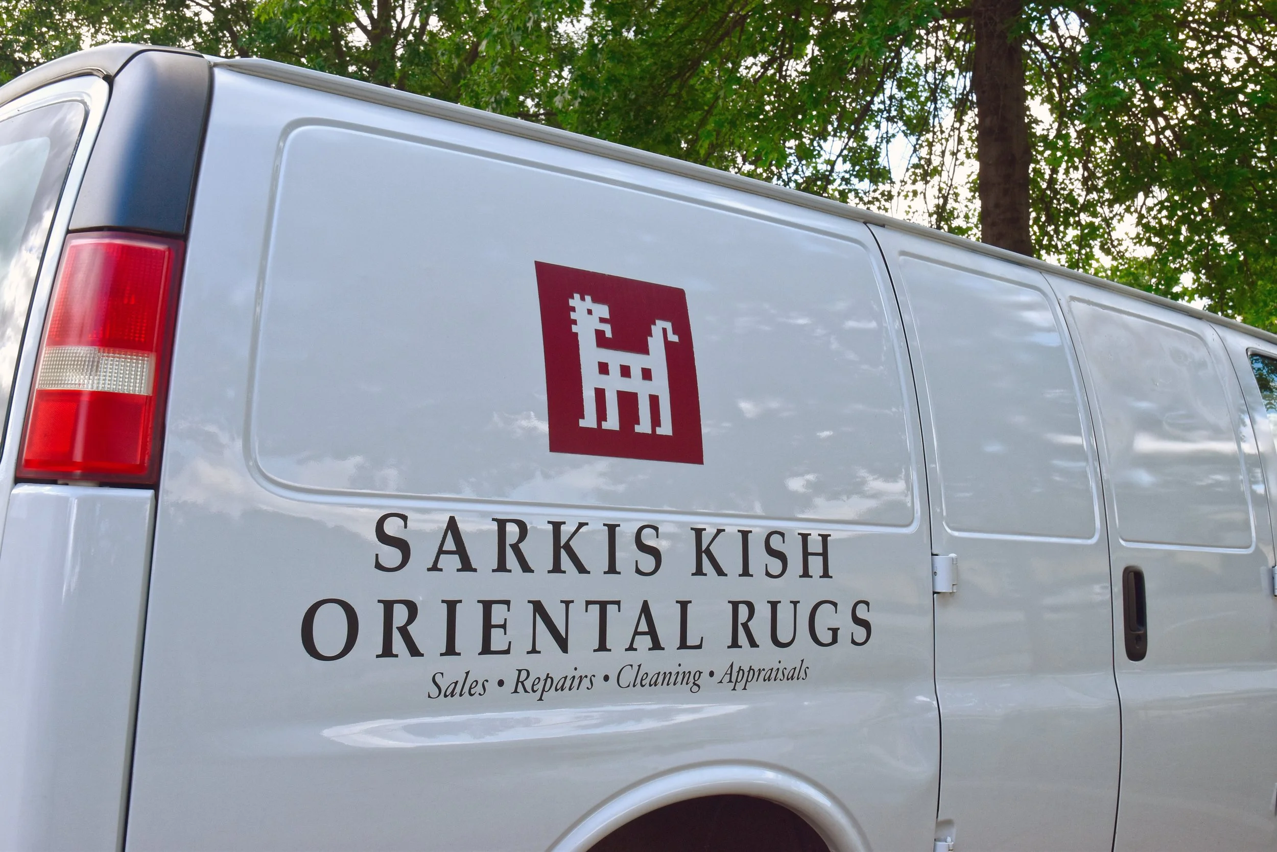  Sarkis Kish Oriental Rugs delivery vehicle signage  Branding creative and design by Chuck Mitchell 