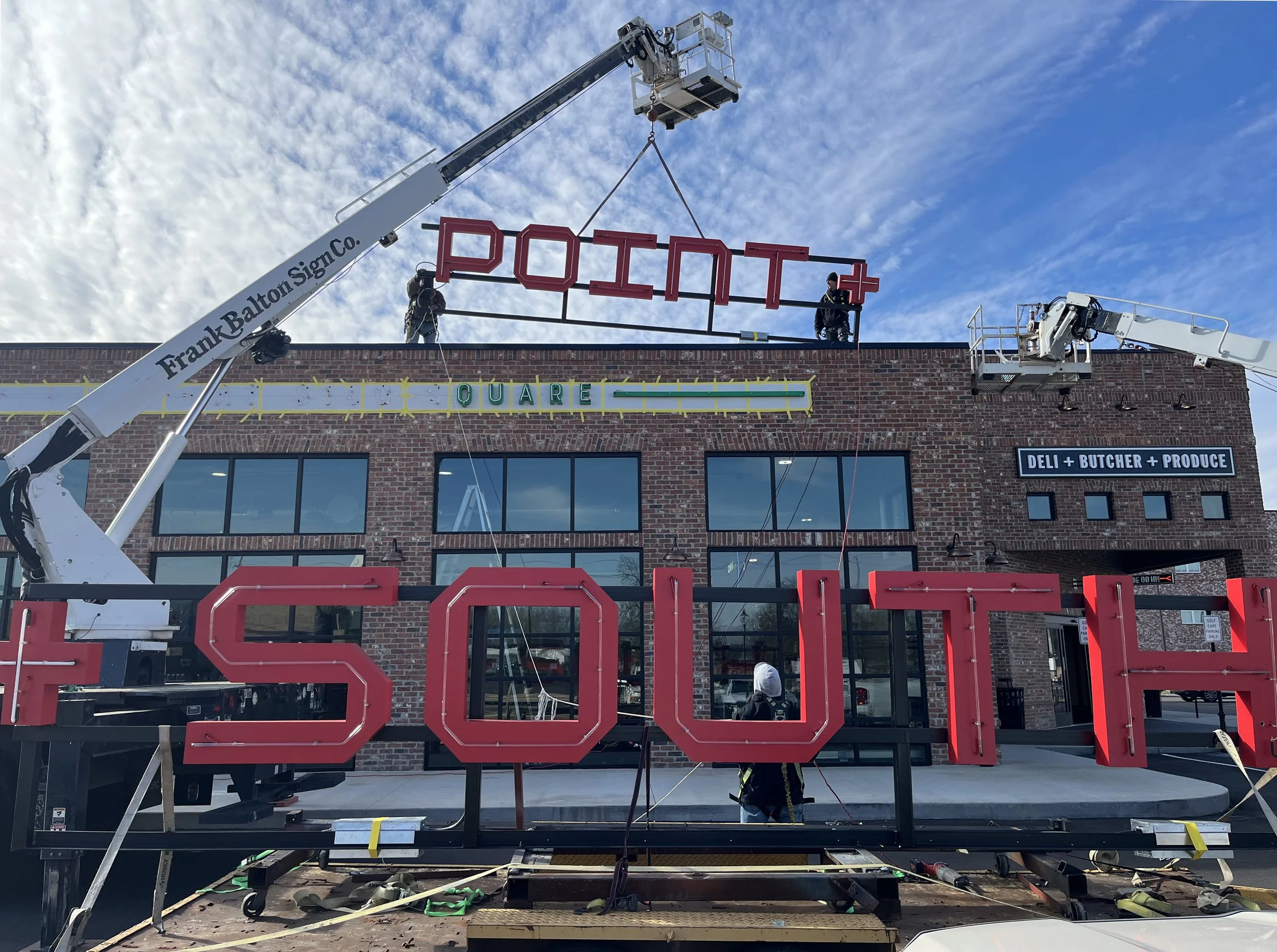  South Point Grocery Silo Square  Southaven, Mississippi  "SOUTH POINT" exterior neon sign installation  Branding creative and signage design by Chuck Mitchell  Sign fabrication and installation by Frank Balton Sign Company 