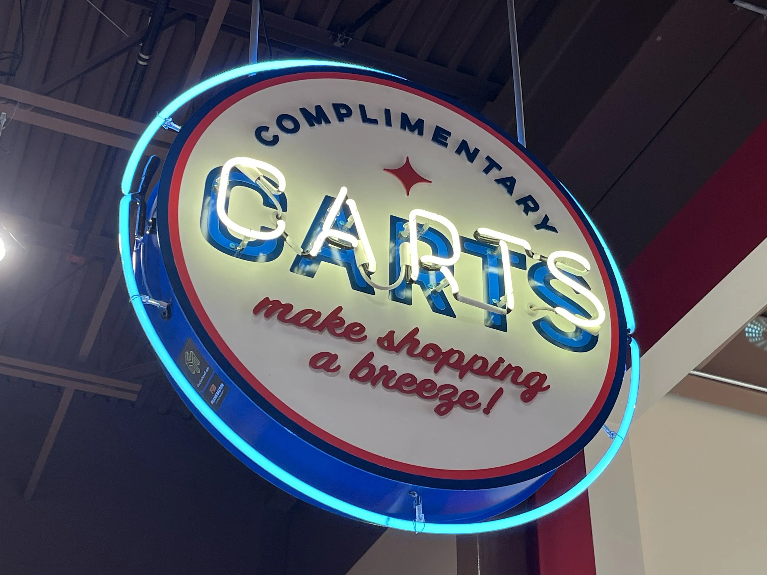  South Point Grocery Silo Square  Southaven, Mississippi  "COMPLIMENTARY CARTS" interior double-face neon sign  Branding creative and signage design by Chuck Mitchell  Sign fabrication and installation by Frank Balton Sign Company 
