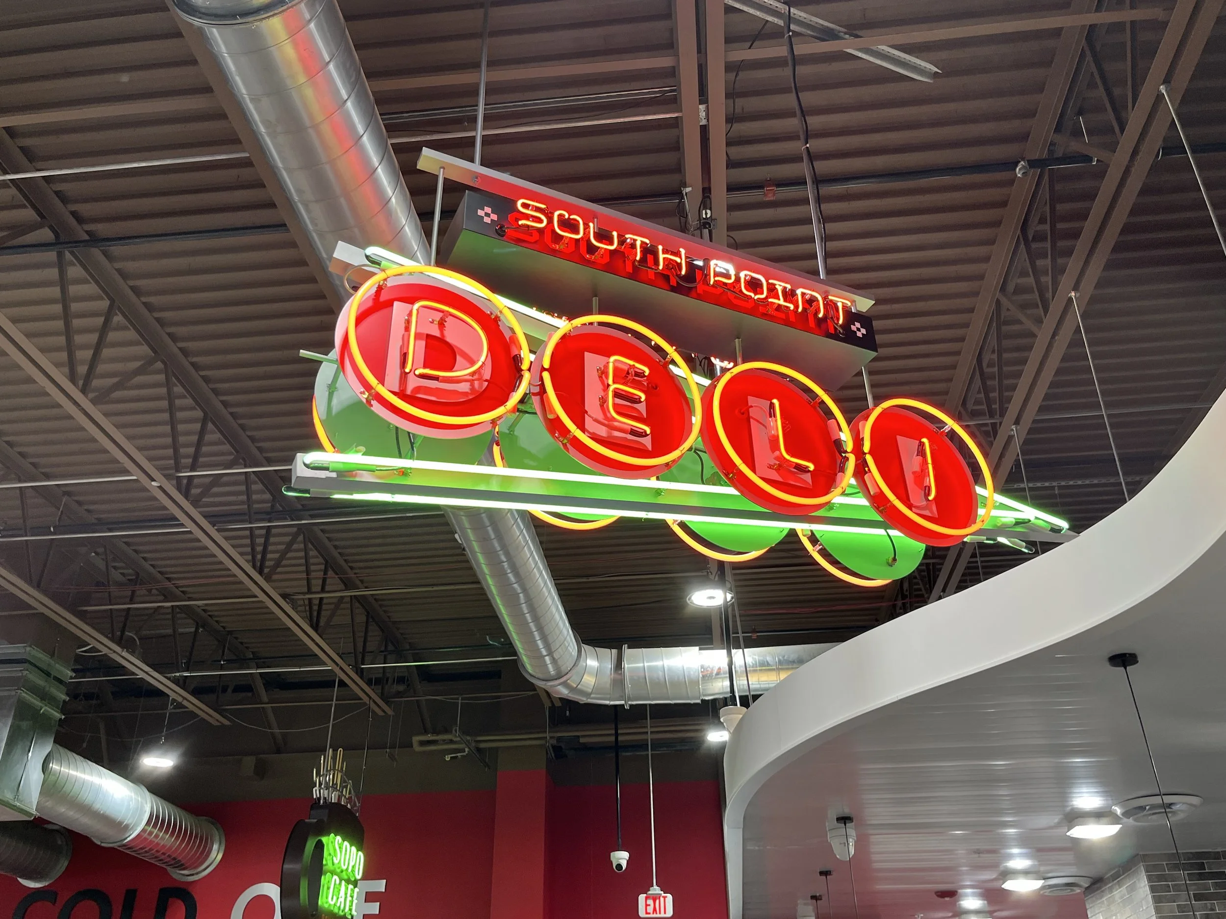  South Point Grocery Silo Square  Southaven, Mississippi  "SOUTH POINT DELI" interior double-face neon sign  Branding creative and signage design by Chuck Mitchell  Sign fabrication and installation by Frank Balton Sign Company 