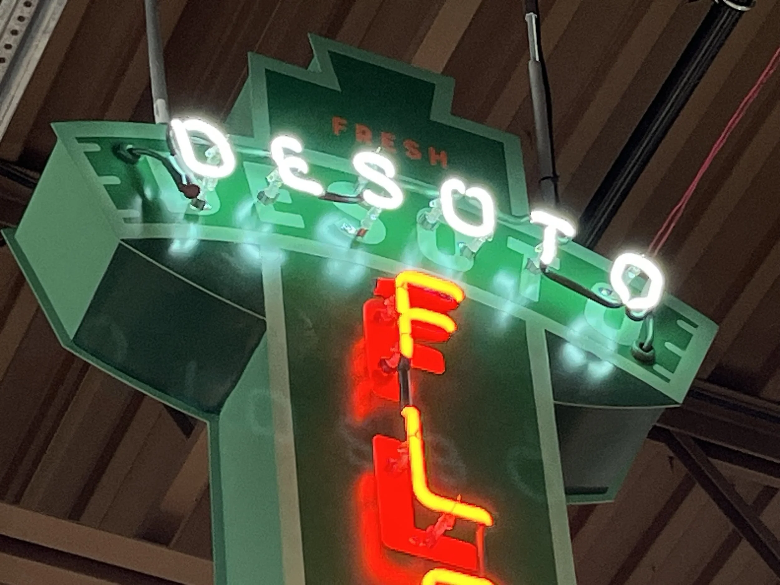  South Point Grocery Silo Square  Southaven, Mississippi  "DESOTO FLOWERS" interior double-face neon sign  Branding creative and signage design by Chuck Mitchell  Sign fabrication and installation by Frank Balton Sign Company 