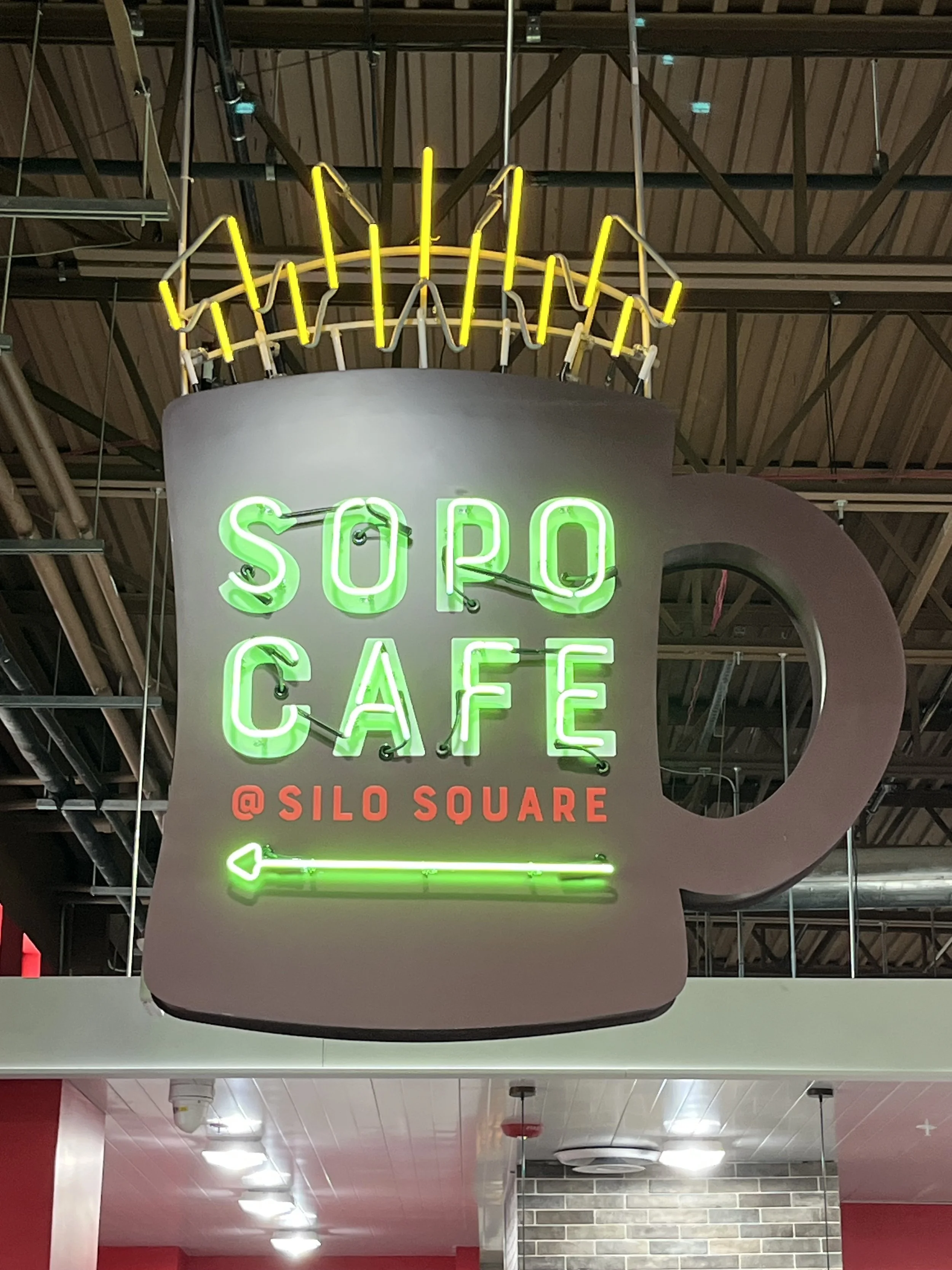  South Point Grocery Silo Square  Southaven, Mississippi  "SOPO CAFE" interior double-face neon sign with motion  Branding creative and signage design by Chuck Mitchell  Sign fabrication and installation by Frank Balton Sign Company 
