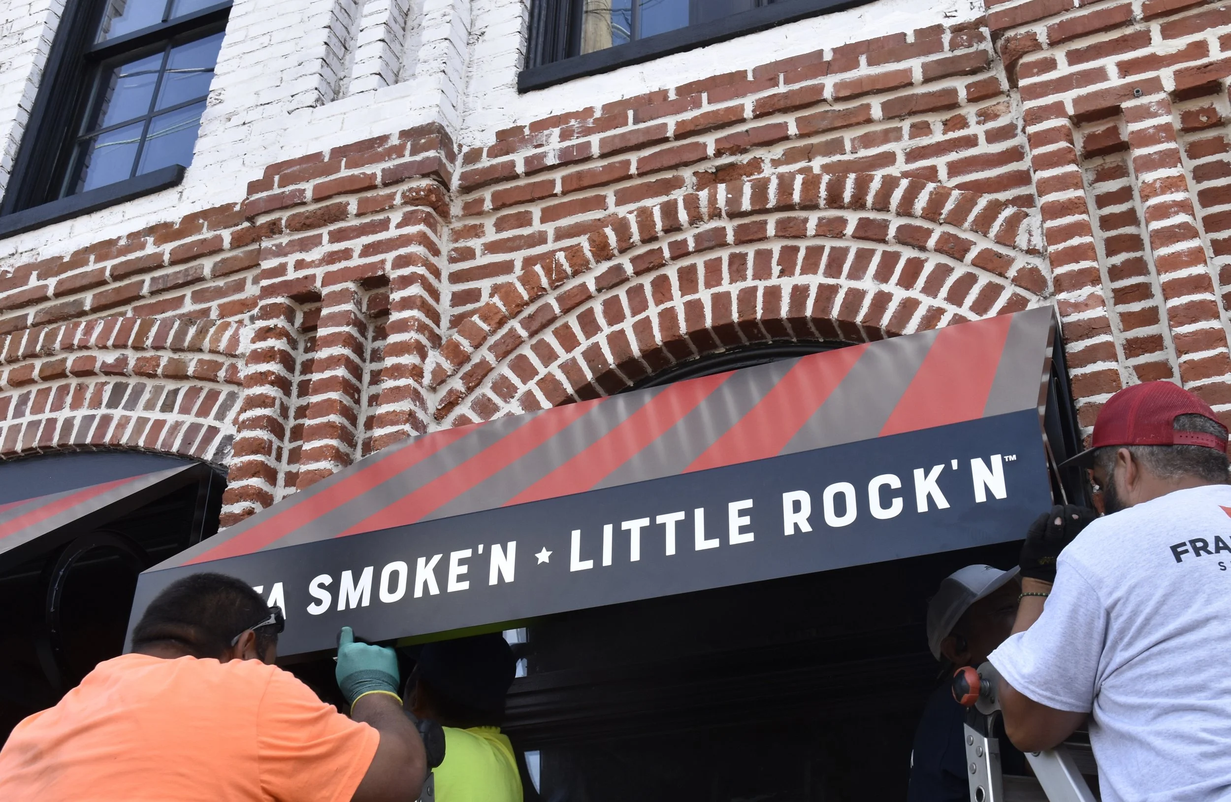  Back Home Barbecue  Little Rock, Arkansas  North face awning with tag line “LOTTA SMOKE’N - LITTLE ROCK’N” written by Chuck Mitchell  Branding and signage package design creative developed by Chuck Mitchell and Reid Mitchell  Sign fabrication and in