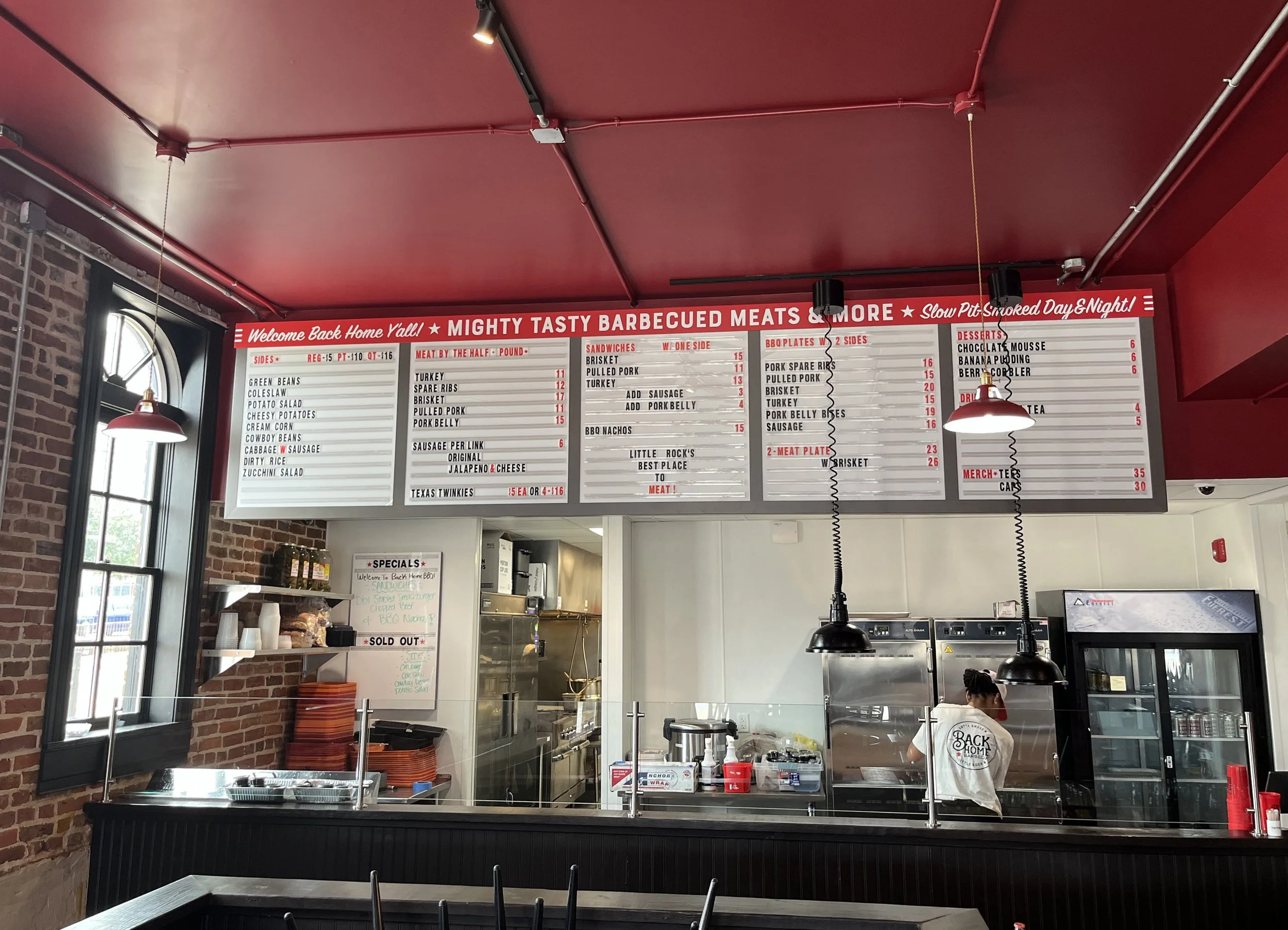  Back Home Barbecue  Little Rock, Arkansas  Custom back-lighted interior menu board with changeable lettering  Branding and signage package design creative developed by Chuck Mitchell and Reid Mitchell  Menu board fabrication and installation by Fran
