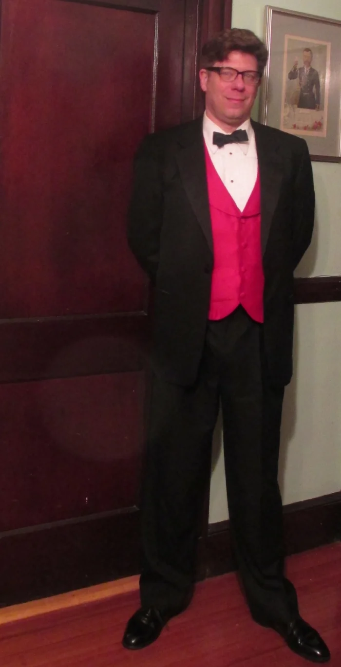 Etiquetteer a few years ago with a Perfectly Proper satin bow tie, exercising the privilege of "creative black tie" with that red vest.