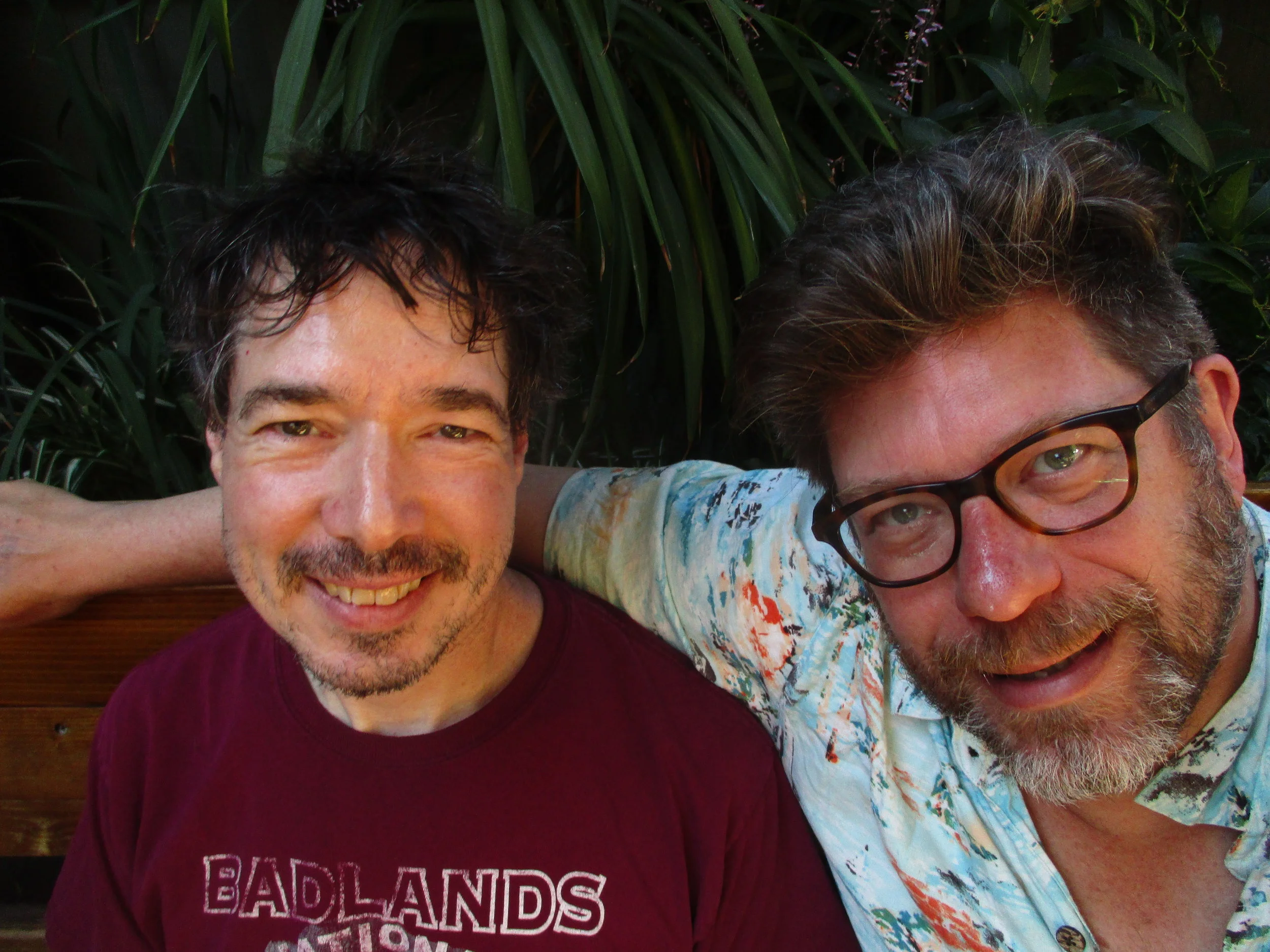 Under the bougainvillea at the Pllsner Inn with my friend Lane.