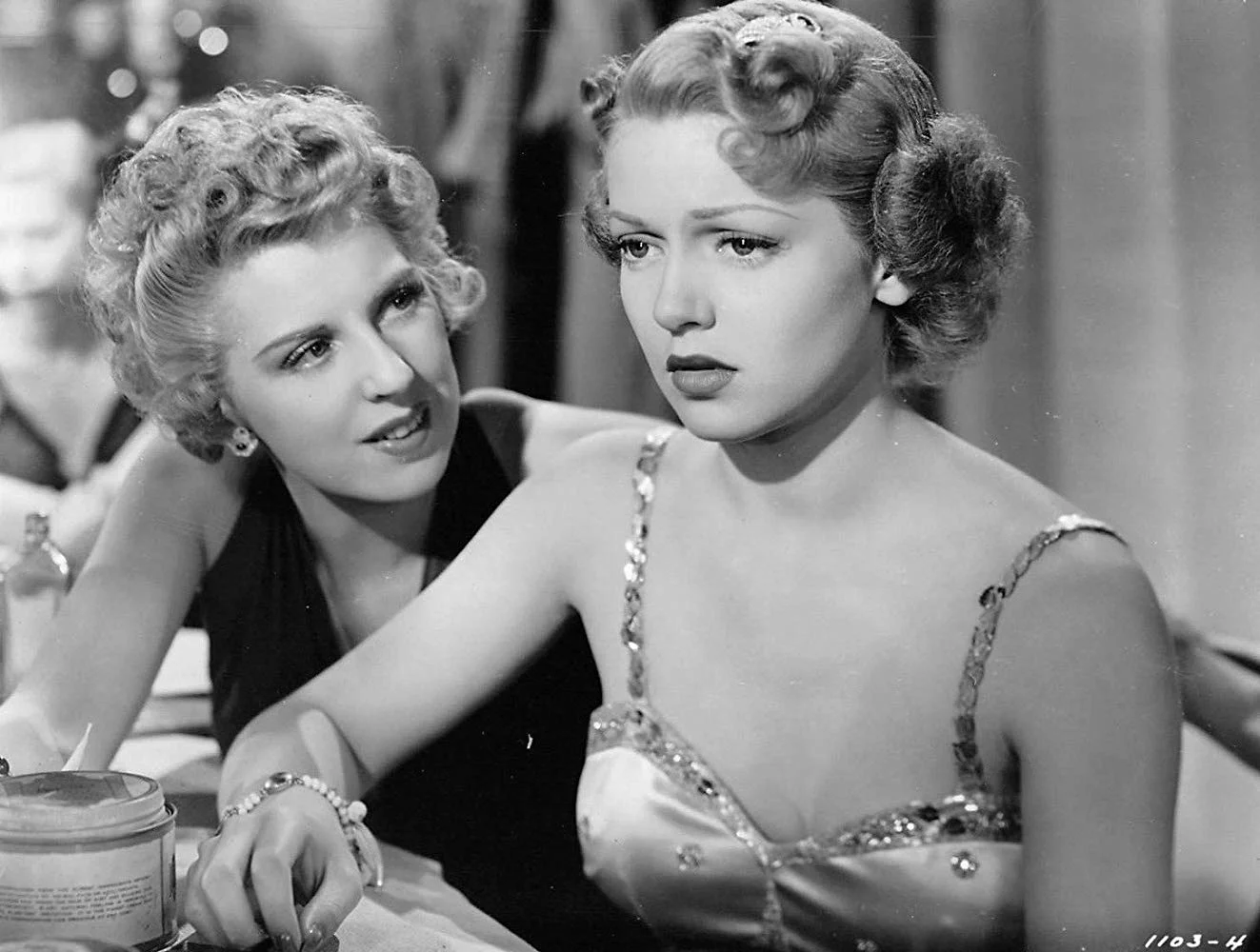 Dennie Moore provides Lana Turner with some serious advice at the Joy Lane.