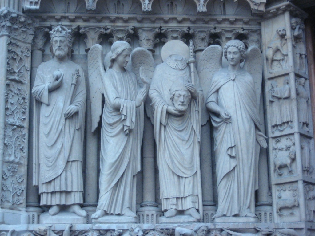 The entrance of Notre Dame, including St. Denis carrying his own head. October, 2008