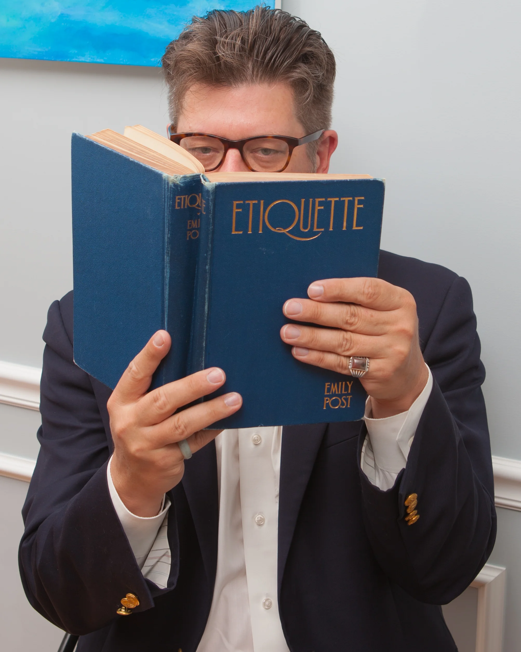 Etiquetteer researching Mrs. Post’s first edition. Portrait by JW Lenswerk.