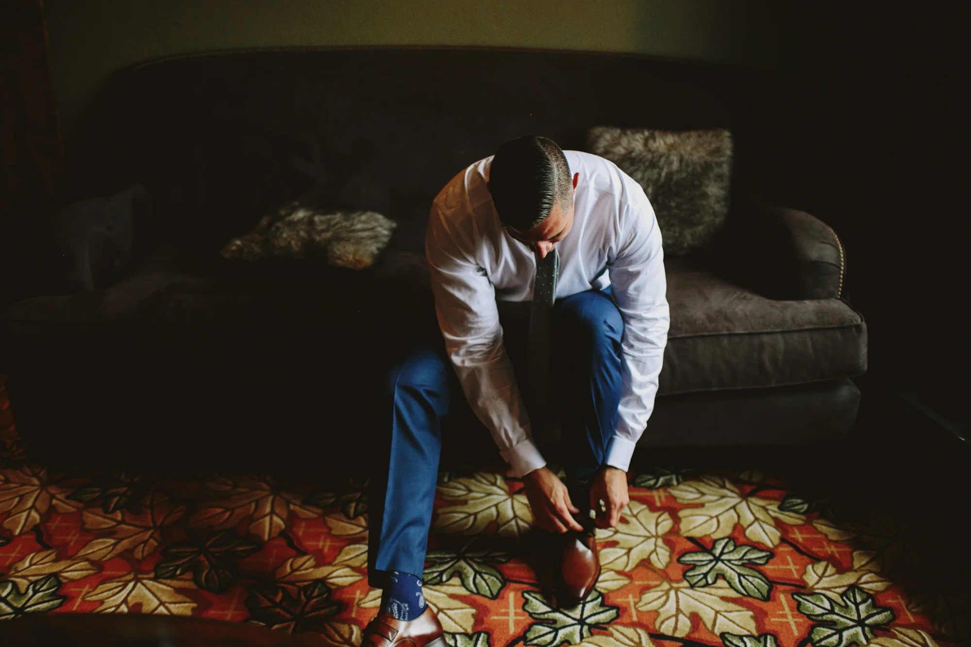 mountain wedding, lake wedding, alberta wedding photographer, groom getting ready, blue suit, brown shoes
