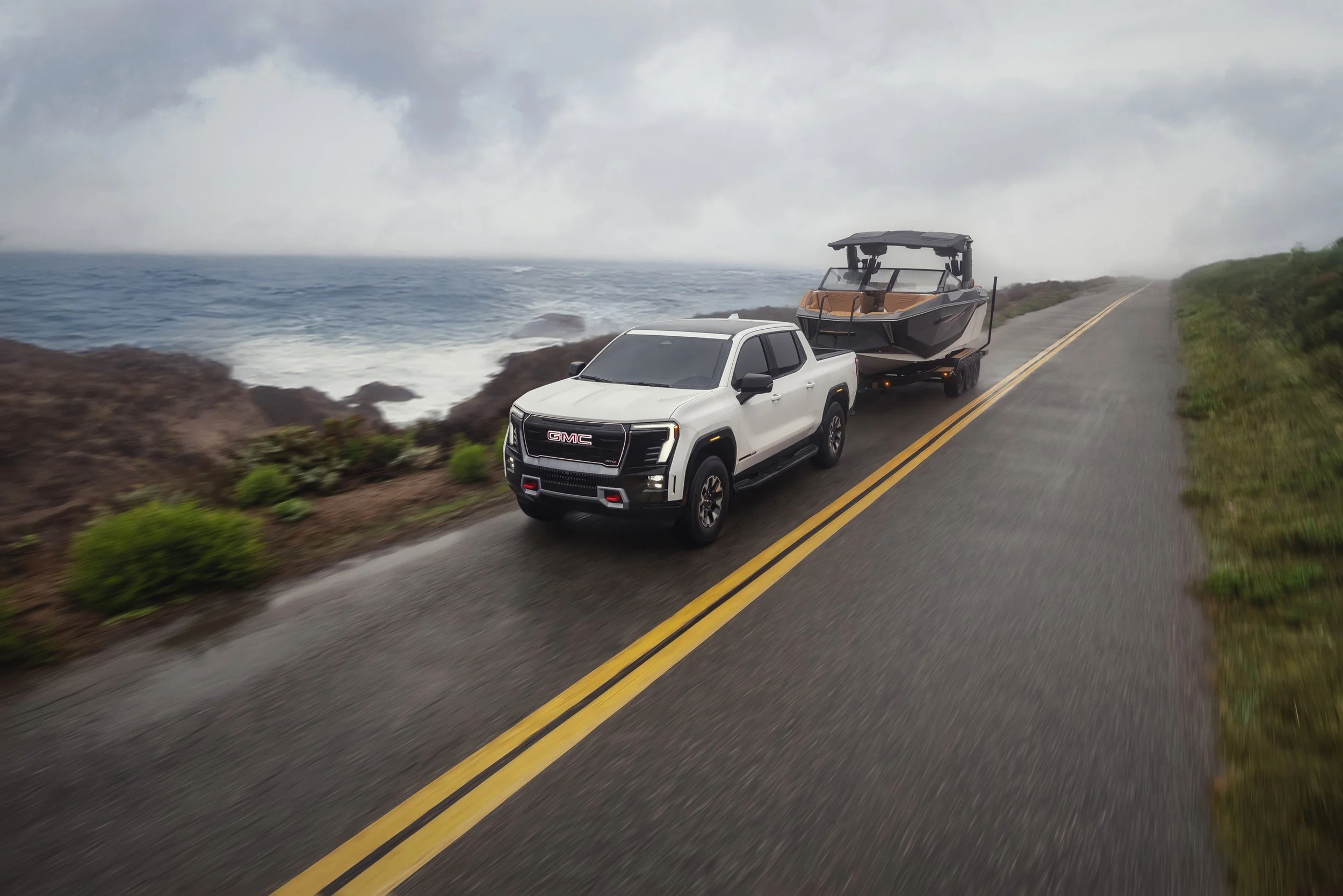 GMC-MY26-SIERRA-EV-AT4-DG-TRAILERING-WITH-BOAT-ACTION_5779_FINAL.jpg