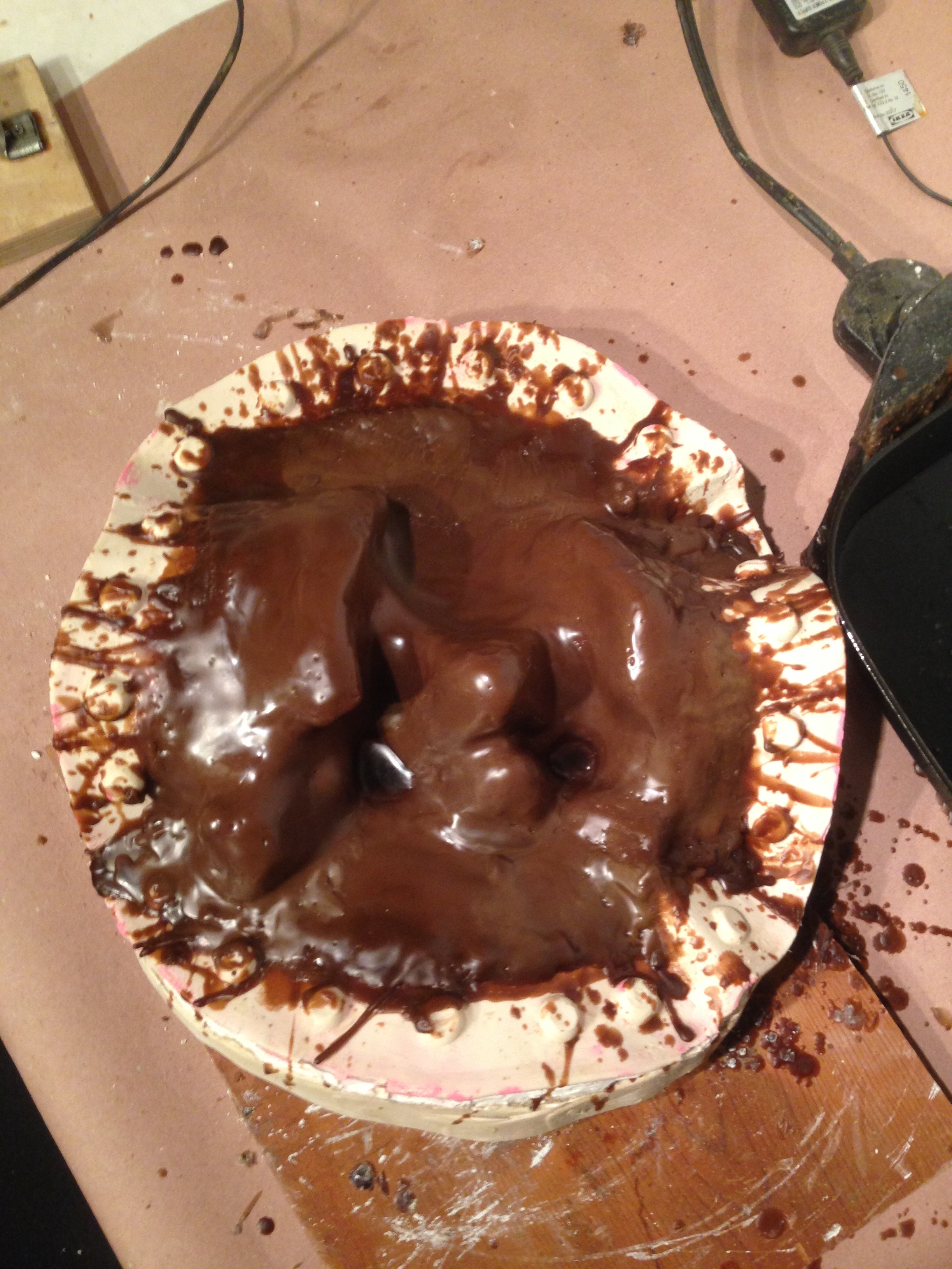 Brushing the wax in the rubber mold...