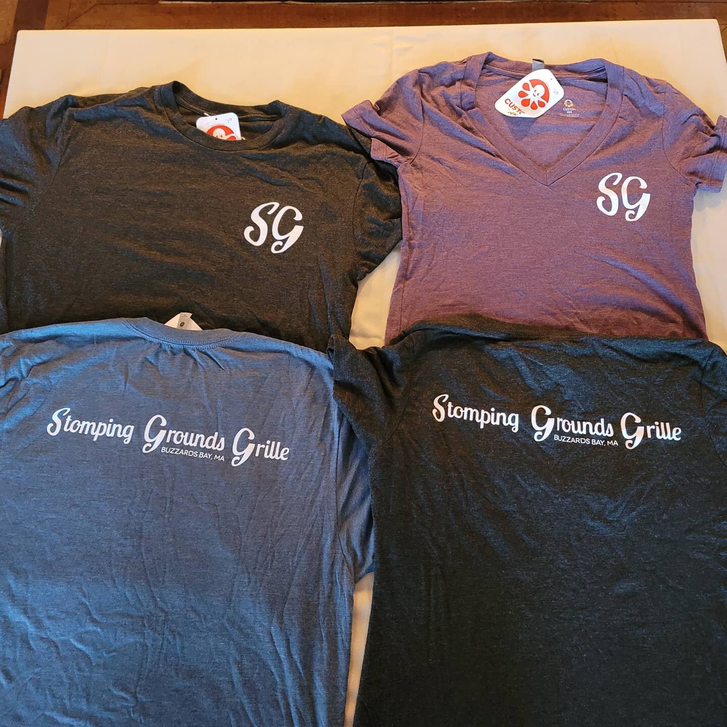 Look what we have available for sale! Limited colors and sizes, for now. Both Crew Neck and V Neck. Extremely light and comfortable, Next Level tri-blend shirts. $25 each. Get em while they're hot! #stompinggroundsgrille #shirts #freepublicity