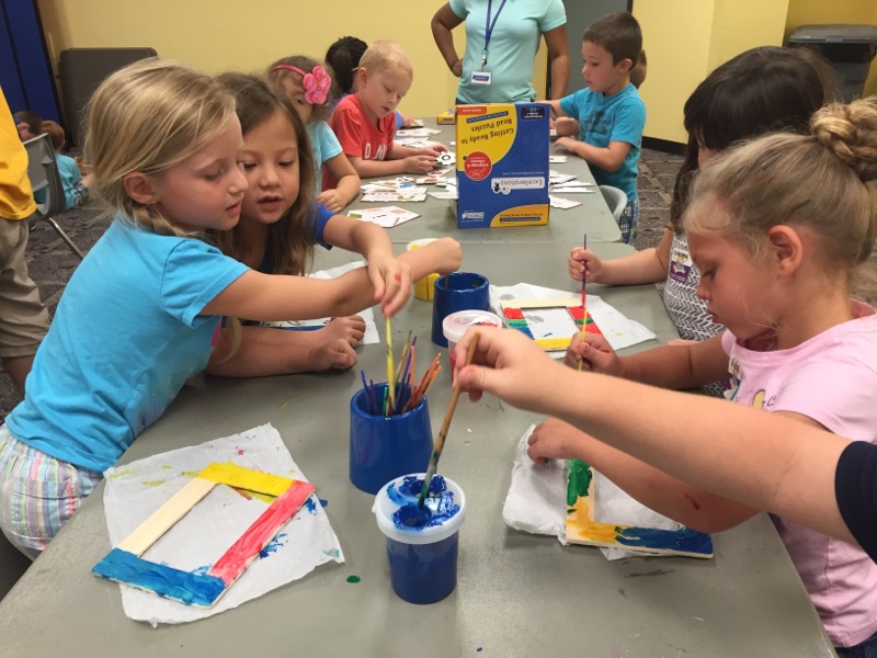 Campers hard at work creating the perfect frame for their road trip memories!