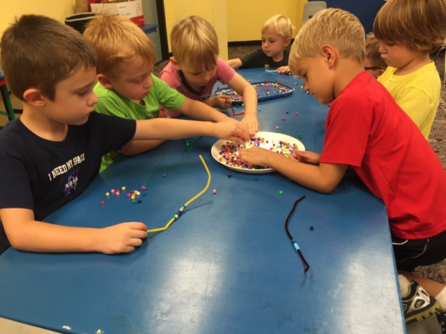 Campers explored color and patterns while picking out beads for a bracelet.