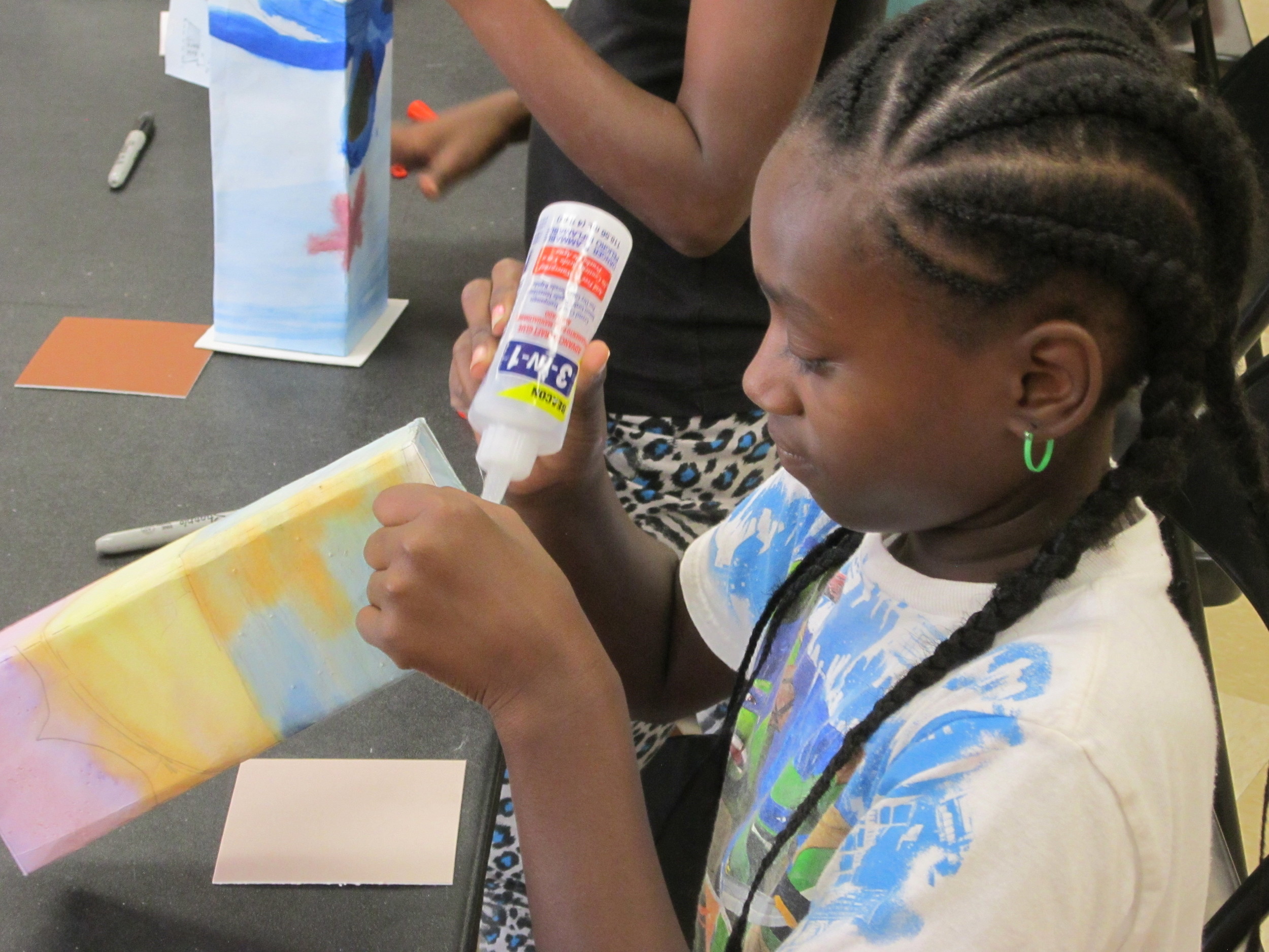 Thomas Jet Jackson girl completes the finishing touches on her lantern.