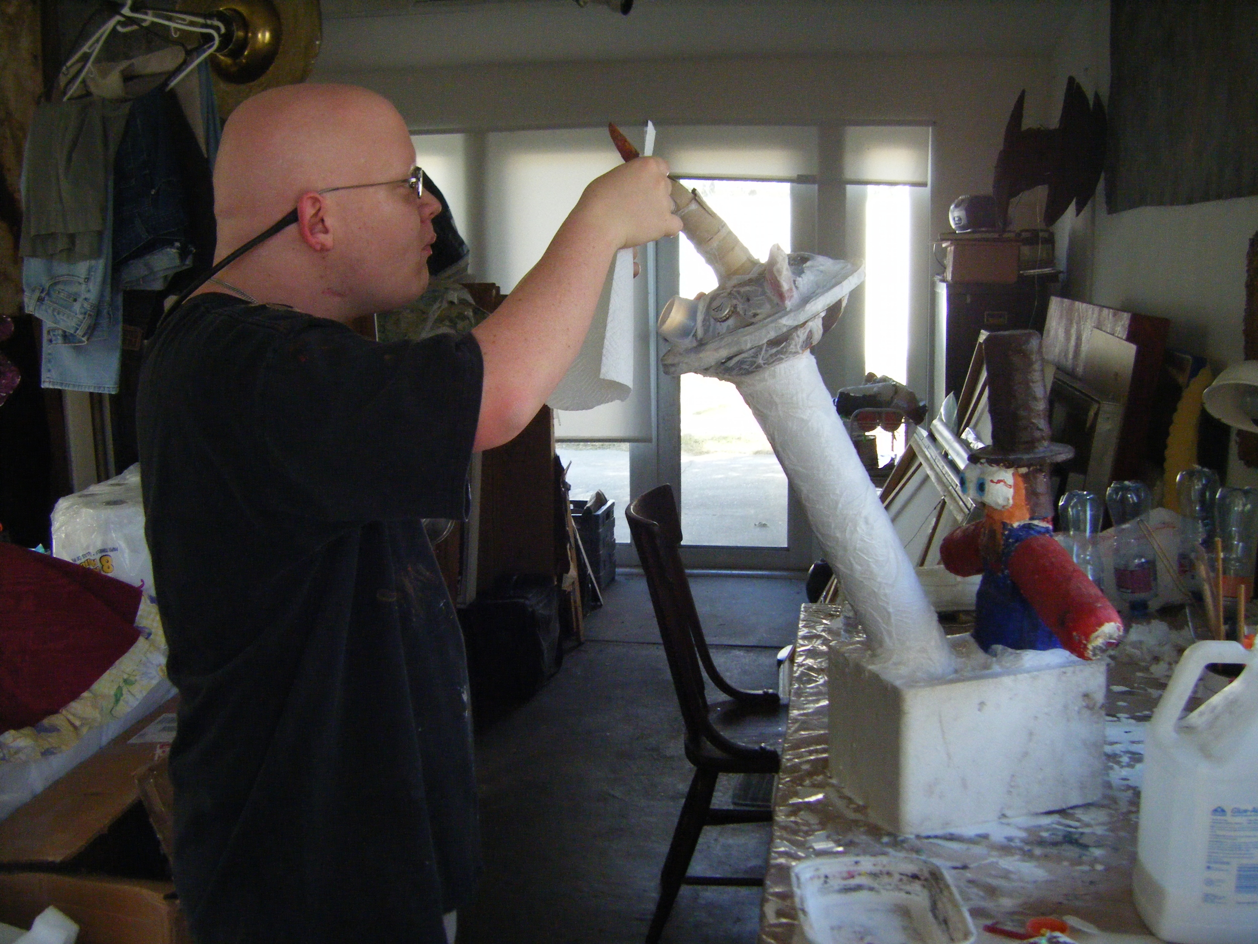 Ryan W., a student in Creative Clay's Transitions program, working on a sculpture in my studio as part of the Art Link program that teams Creative Clay artists with professional artists.
