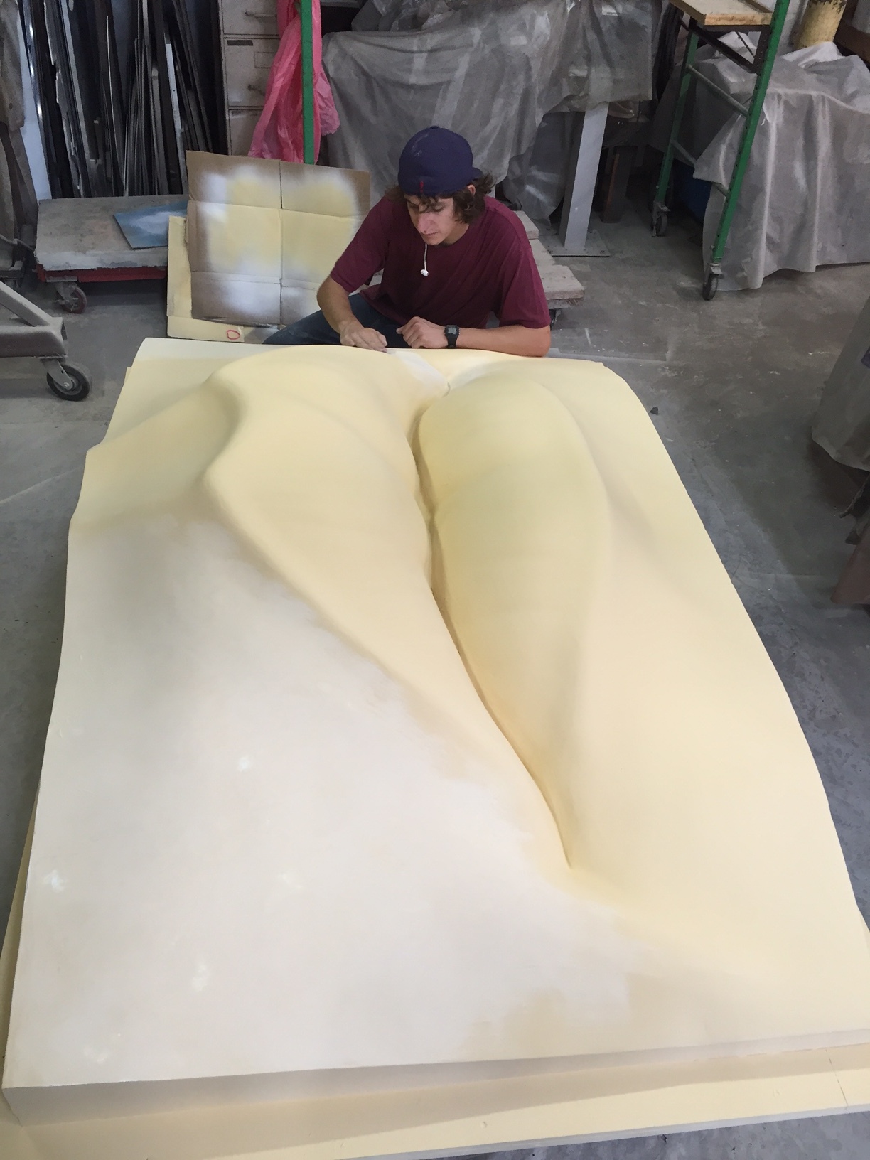 A layer of polyester resin is applied, then a secret recipe of primer and filler and now more sanding and more sanding…