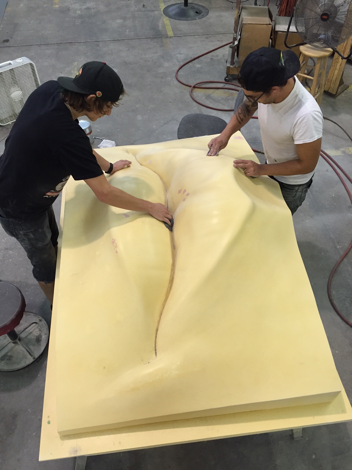 We are making final surface preparations for casting a fiberglass mold of the lips.