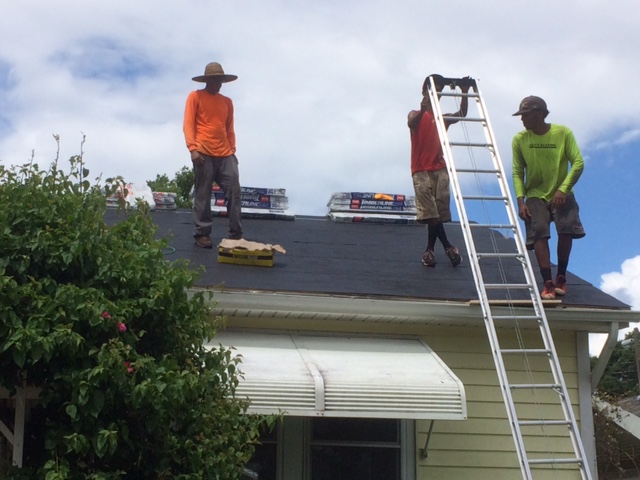 A waterproof barrier is added to my roof before the rains come.