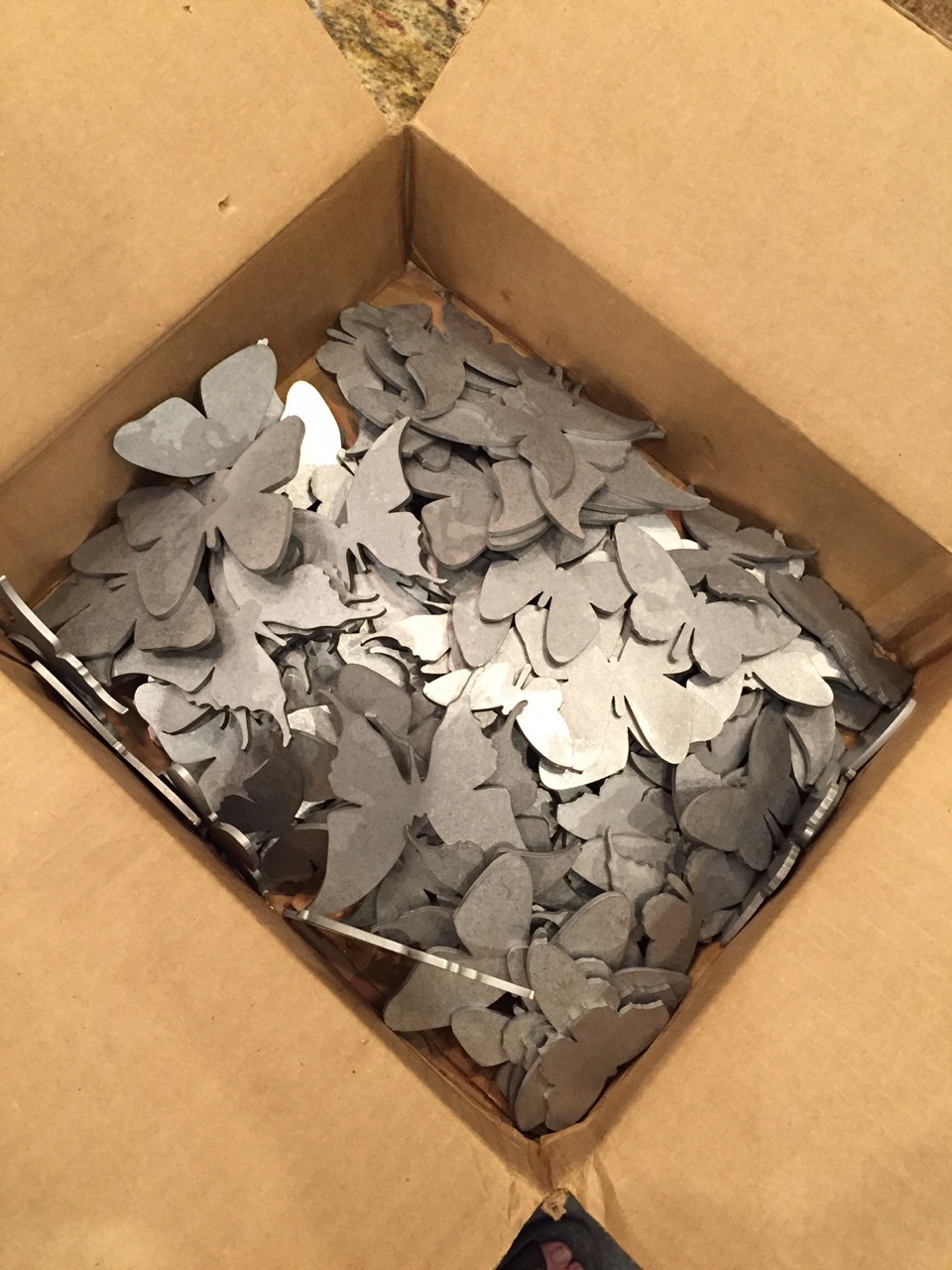 This is the box of butterflies after being tumbled in a stone tumbler to surface the pieces and remove sharp edges. 660 butterflies in all!