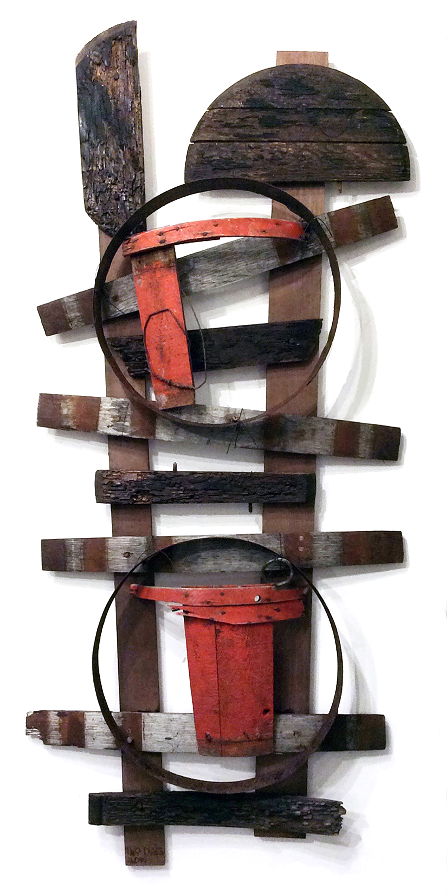 Two Dunes. Constructed from deteriorated bucket staves and bottoms as well as red basket parts, 30"W x 65"H x 5"D, 2016.