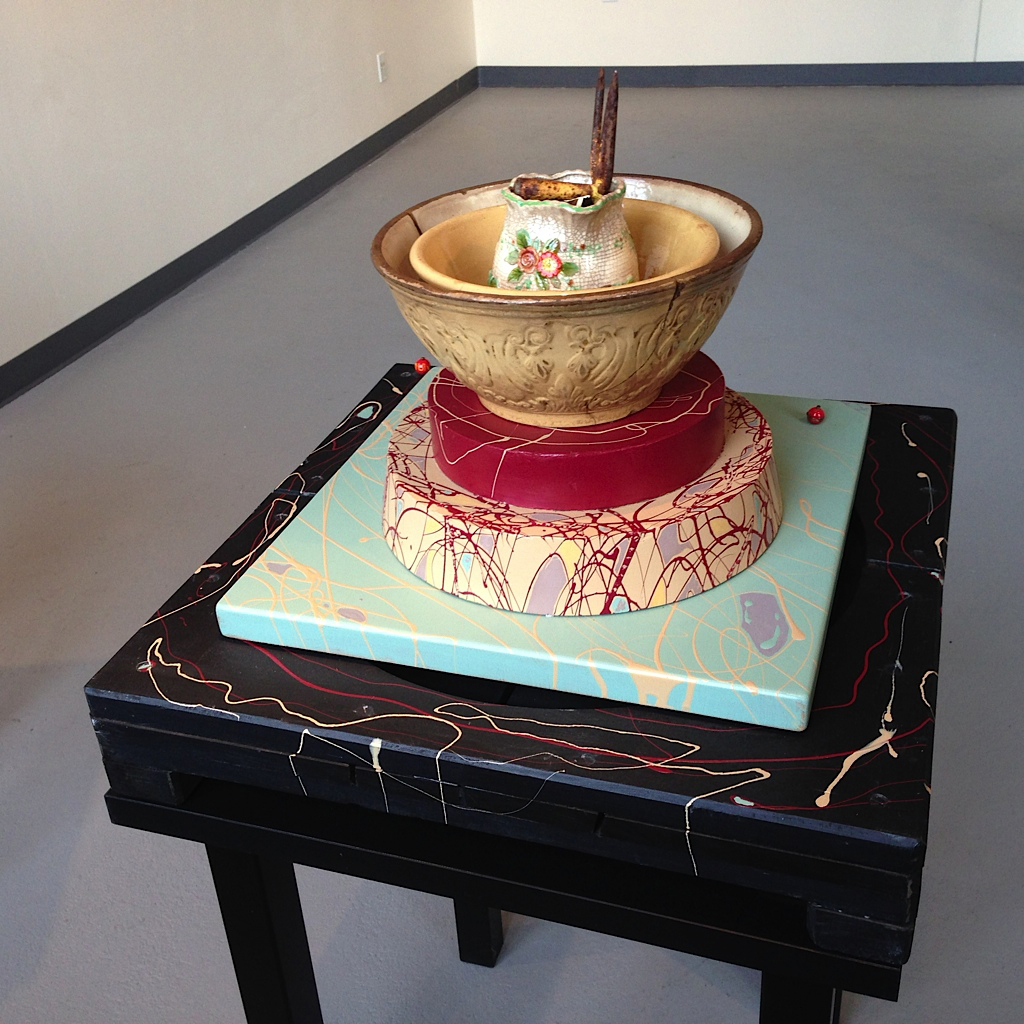 Crazed. Revised 2013. Old, crazed deteriorated bowls and pitcher mounted on wood parts and a painted table. 24" x 24" x 49"H.