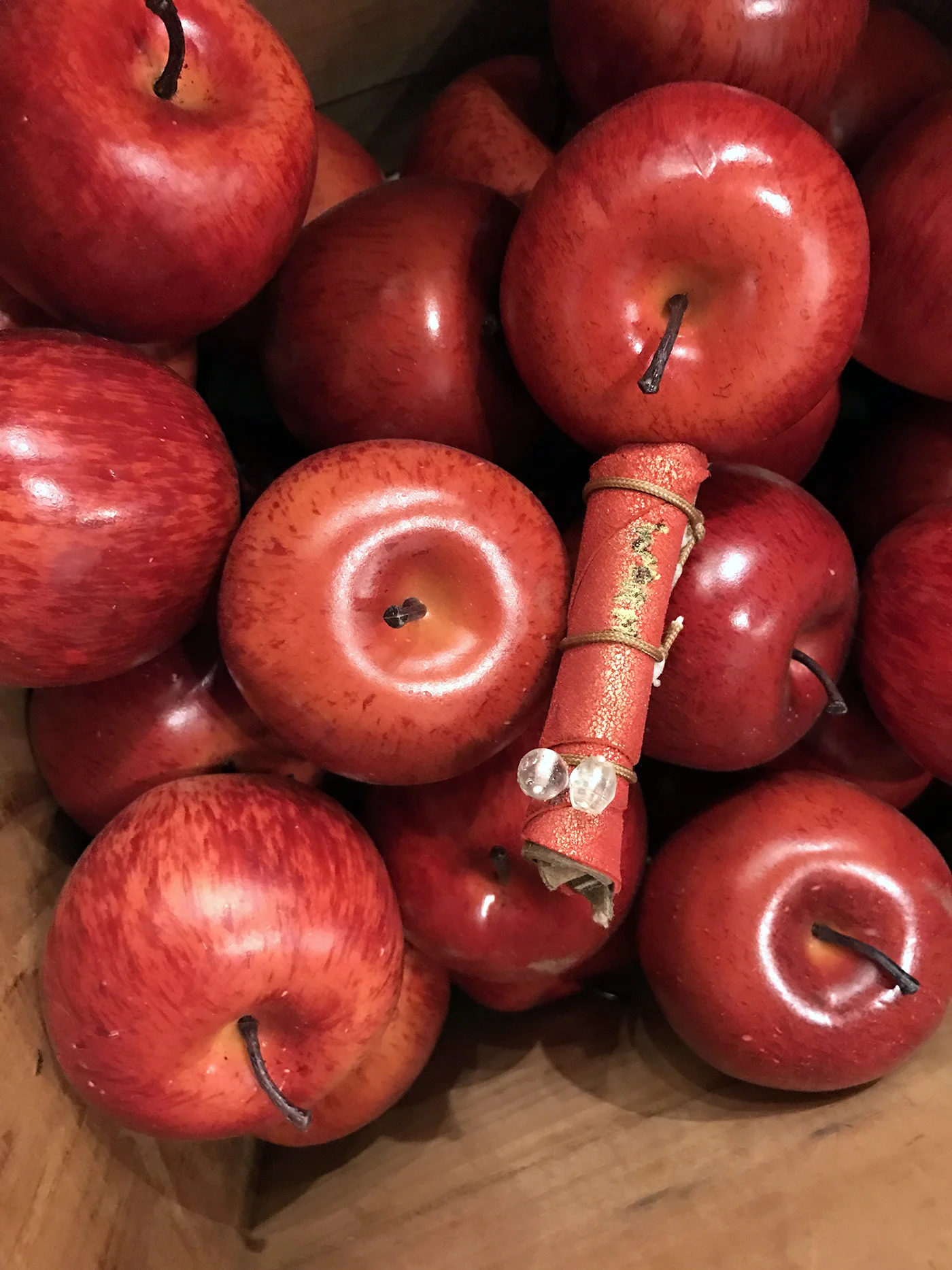 Apples With Worm. Close-up looking down into the wooden crate. 2017 15"X25"x20"H.