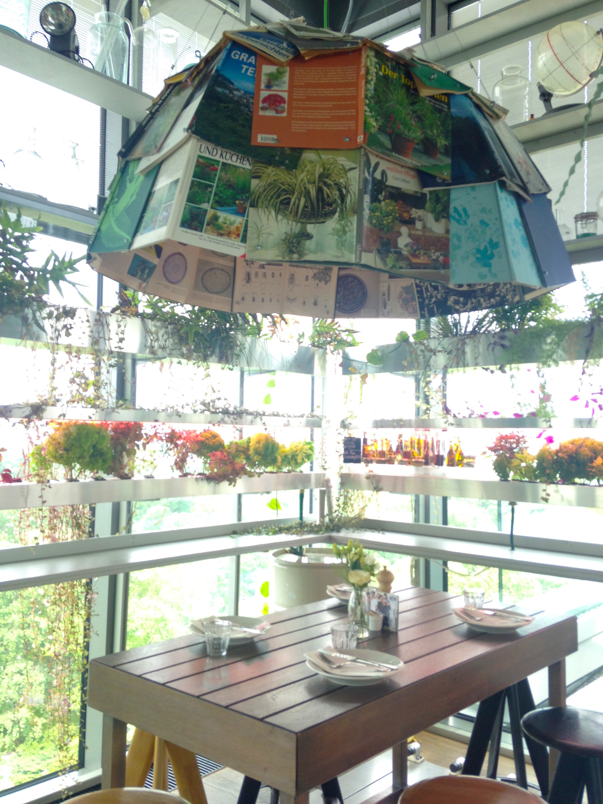 A over-sized lamp shade made of magazines and books. Genius!