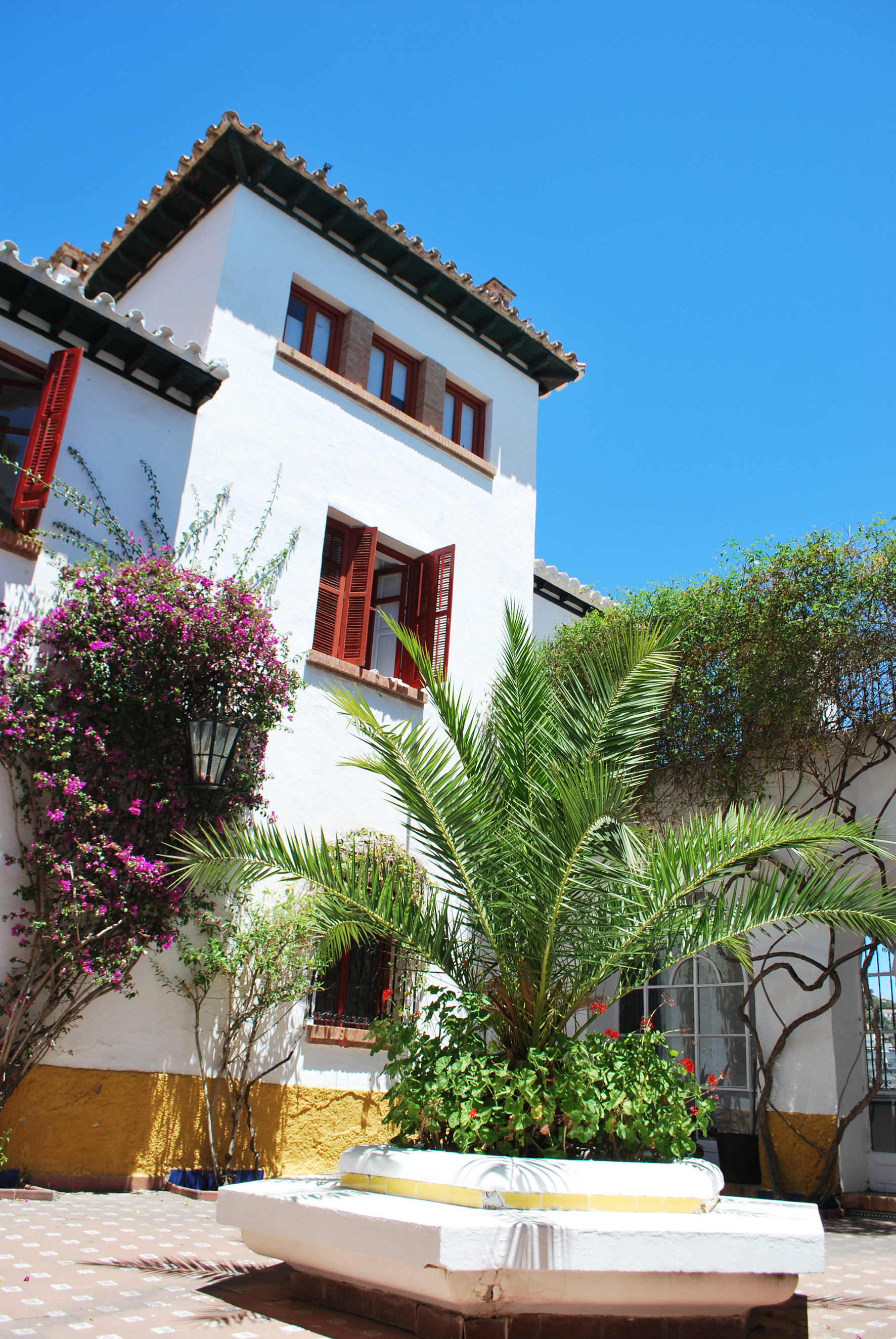 Traditional shutters keep the interior cool.